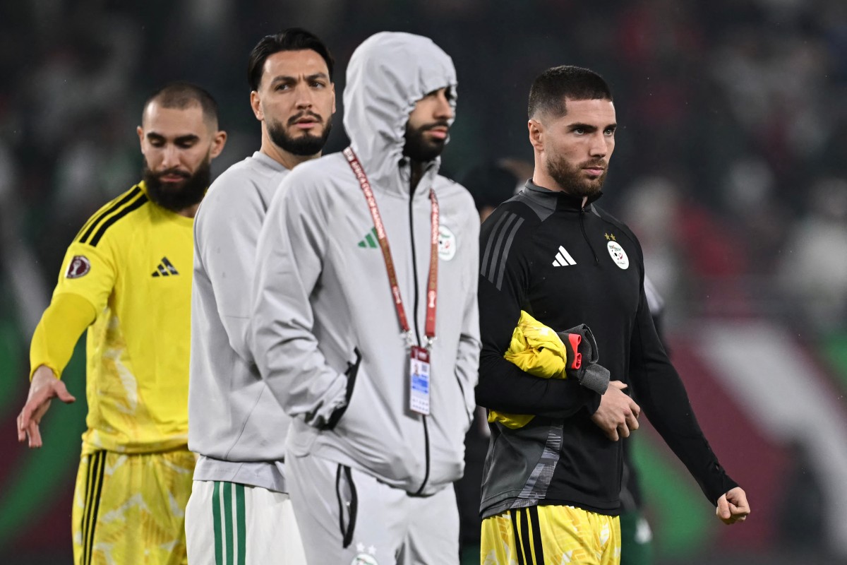 (From L) Algeria's goalkeeper #1 Anthony Mandrea, Algeria's defender #21 Ramy Bensebaini and Algeria's goalkeeper #23 Luca Zidane leave the pitch at the end of the Africa Cup of Nations (CAN) Group E football match between Equatorial Guinea and Algeria at Moulay Hassan Stadium in Rabat on December 31, 2025.