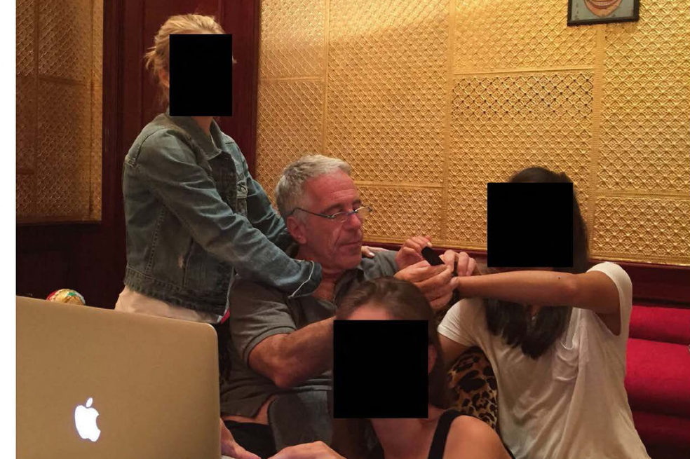 This undated and unlocated handout image released by Democrats on the House Oversight Committee on December 18, 2025 shows late convicted sex offender Jeffrey Epstein (2L) sitting next to women whose faces have been redacted.
Democratic lawmakers released a new cache of photos and documents on December 18 from the estate of convicted sex offender Jeffrey Epstein.