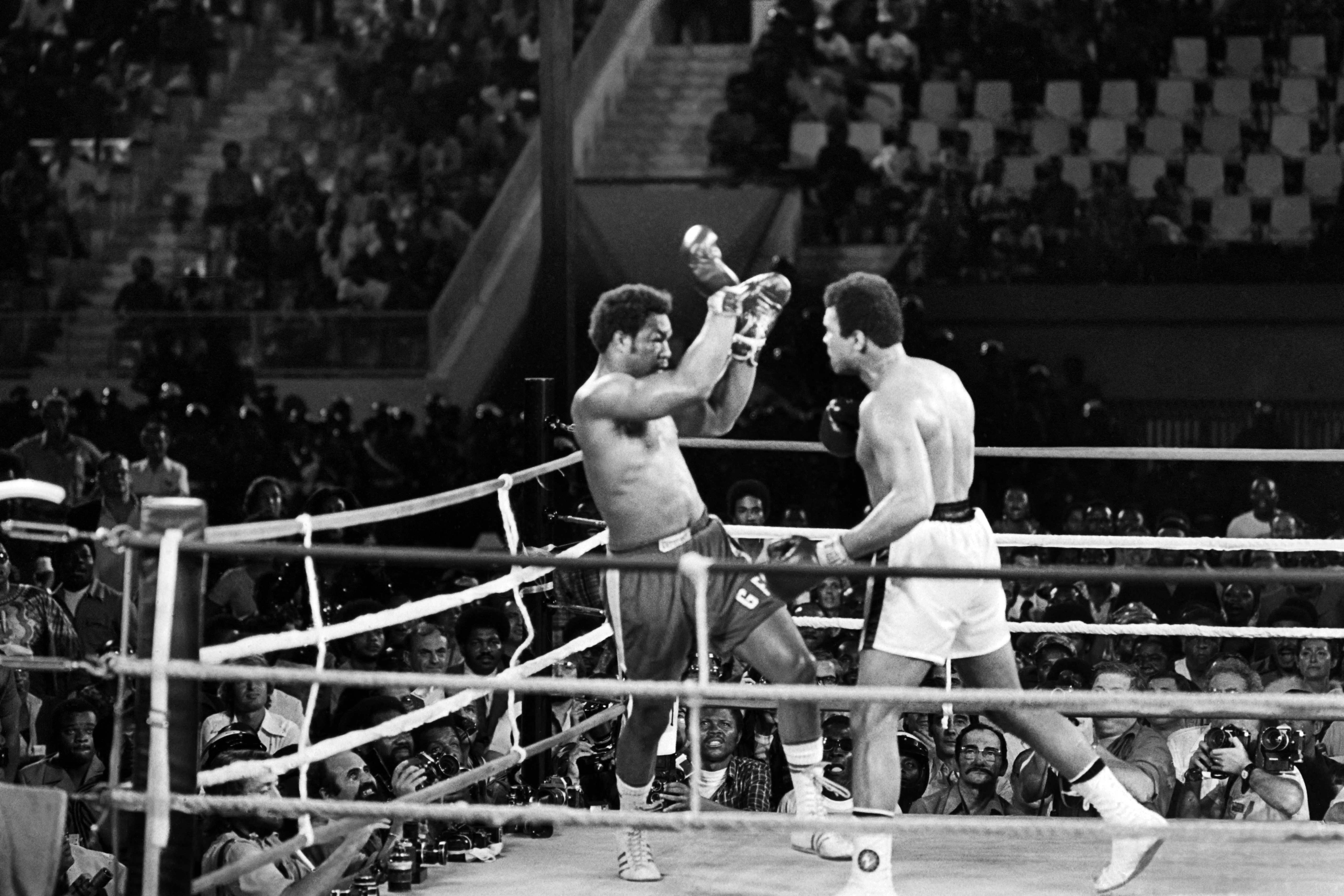 (FILES) In this photo taken on October 30, 1974 shows the fight between US boxing heavyweight champions, Muhammad Ali (L) (born Cassius Clay) and George Foreman in Kinshasa.