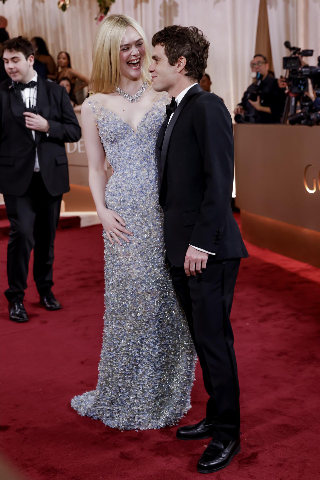 BEVERLY HILLS (United States), 12/01/2026.- US actress Elle Fanning (L) and US business executive Gus Wenner (R) arrive for the 83rd annual Golden Globe Awards ceremony at the Beverly Hilton Hotel in Beverly Hills, California, USA, 11 January 2026. Artists in various film and television categories are awarded Golden Globes by the Hollywood Foreign Press Association. EFE/EPA/JILL CONNELLY

