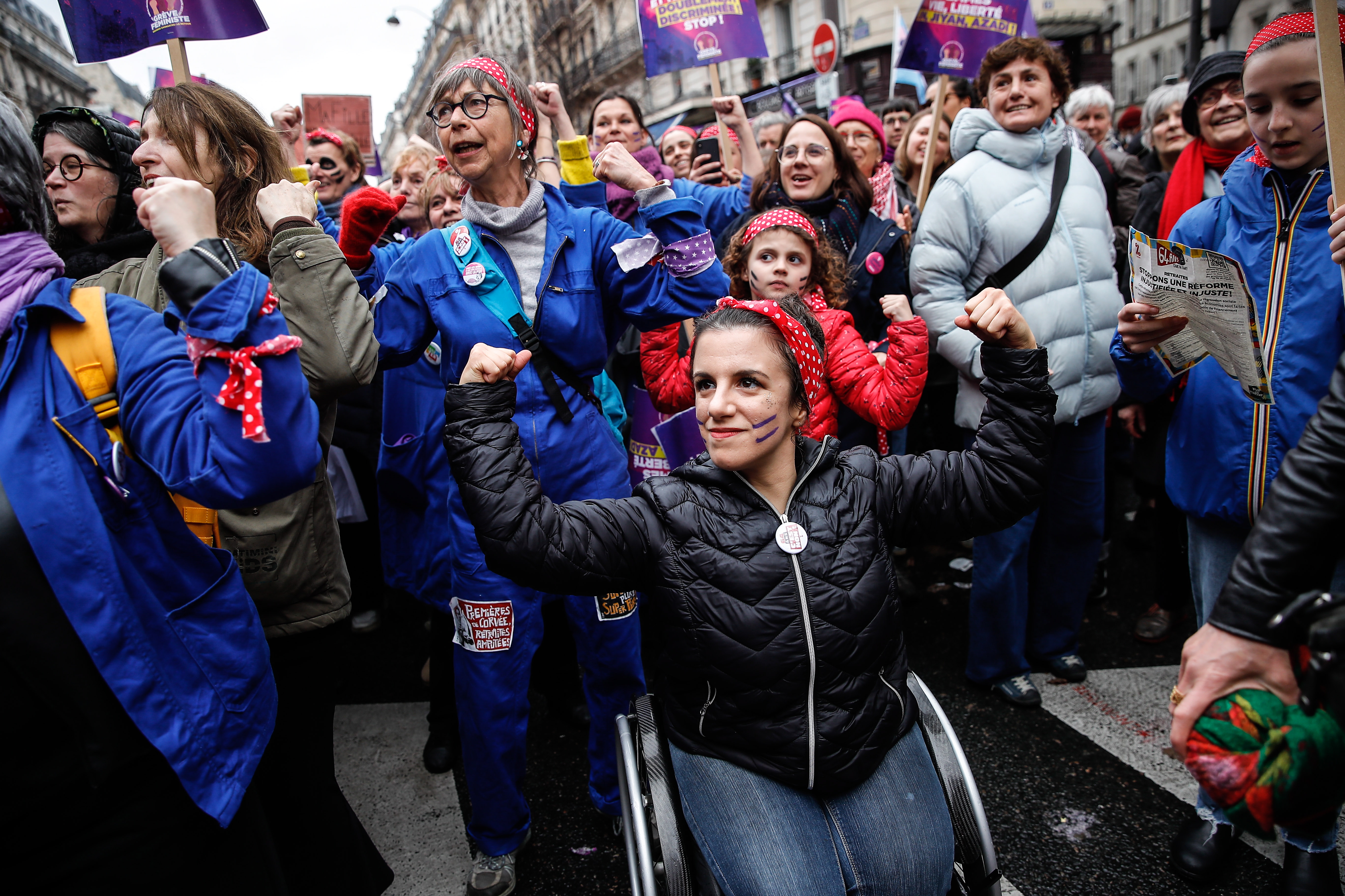 Paris (France), 08/03/2023.- A woman in a wheelchair participates in the choreography of the feminist collective Les Rosies during the march for the international day of fight for women's rights in Paris, France, 08 March 2023. International Women's Day (IWD) is observed annually on 08 March worldwide to highlight women's rights, as well as issues such as violence and abuse against women. (Francia) EFE/EPA/TERESA SUAREZ