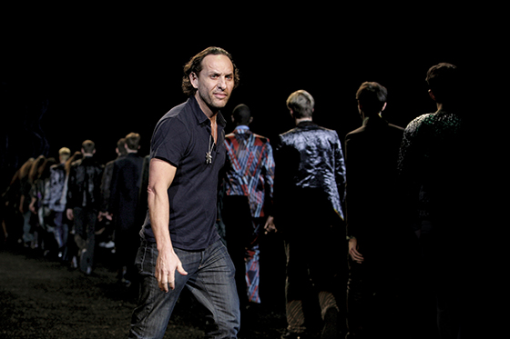 Spanish designer Custo Dalmau of Custo Barcelona walks with the models at the end of his fashion show at Mercedes-Benz Fashion Week in New York on February 7, 2008. AFP PHOTO / Nicholas ROBERTS