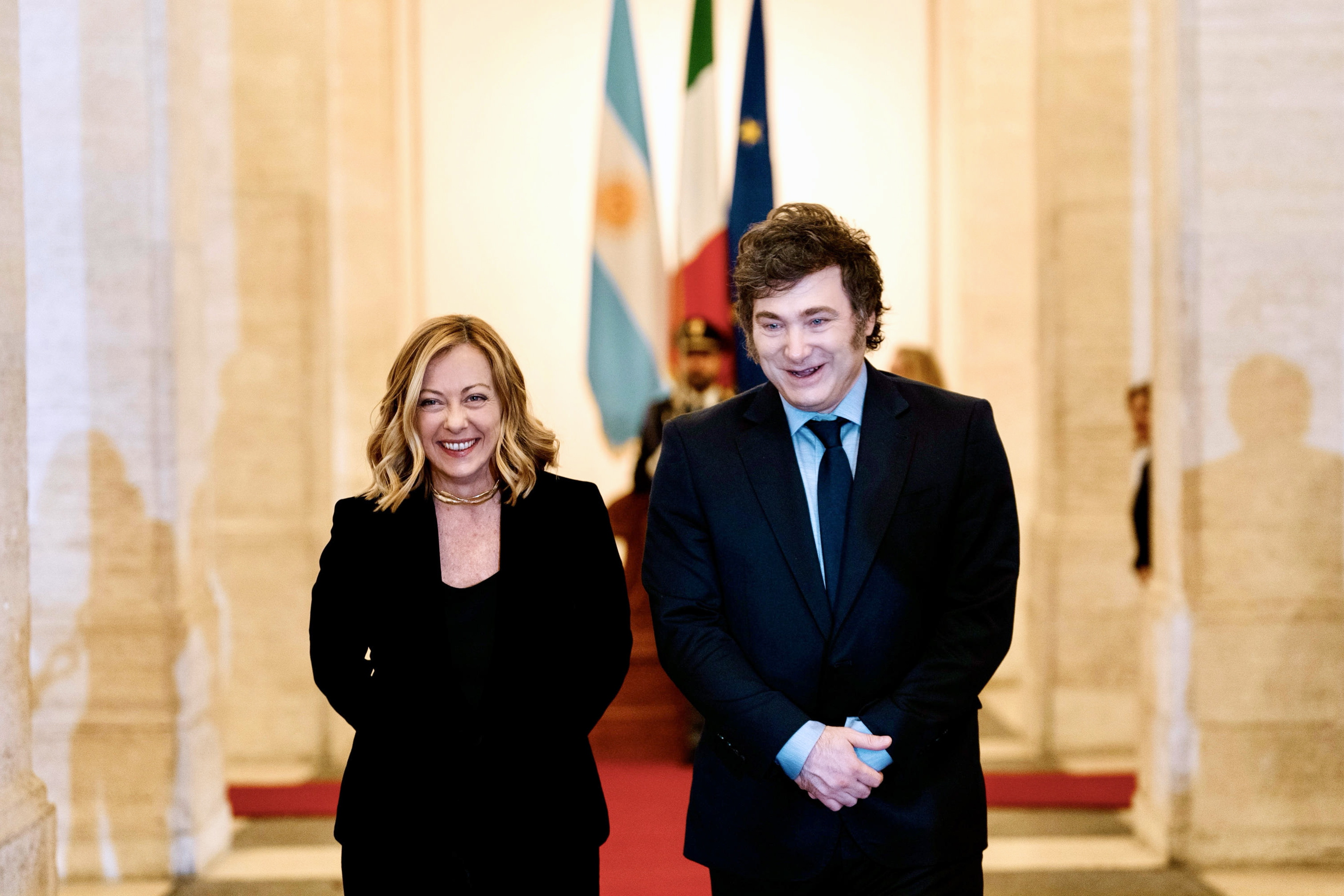 Rome (Italy), 13/12/2024.- A handout photo made available by Chigi Palace Press Office shows Italian Prime Minister Giorgia Meloni (L) welcoming Argentine President Javier Milei (R) at the Chigi Palace, in Rome, Italy, 13 December 2024. The Argentine president is on an official visit to Rome, where he will attend the Brothers of Italy party's annual festival Atreju on 14 December. (Italia, Roma) EFE/EPA/FILIPPO ATTILI/PALAZZO CHIGI HANDOUT HANDOUT EDITORIAL USE ONLY/NO SALES
