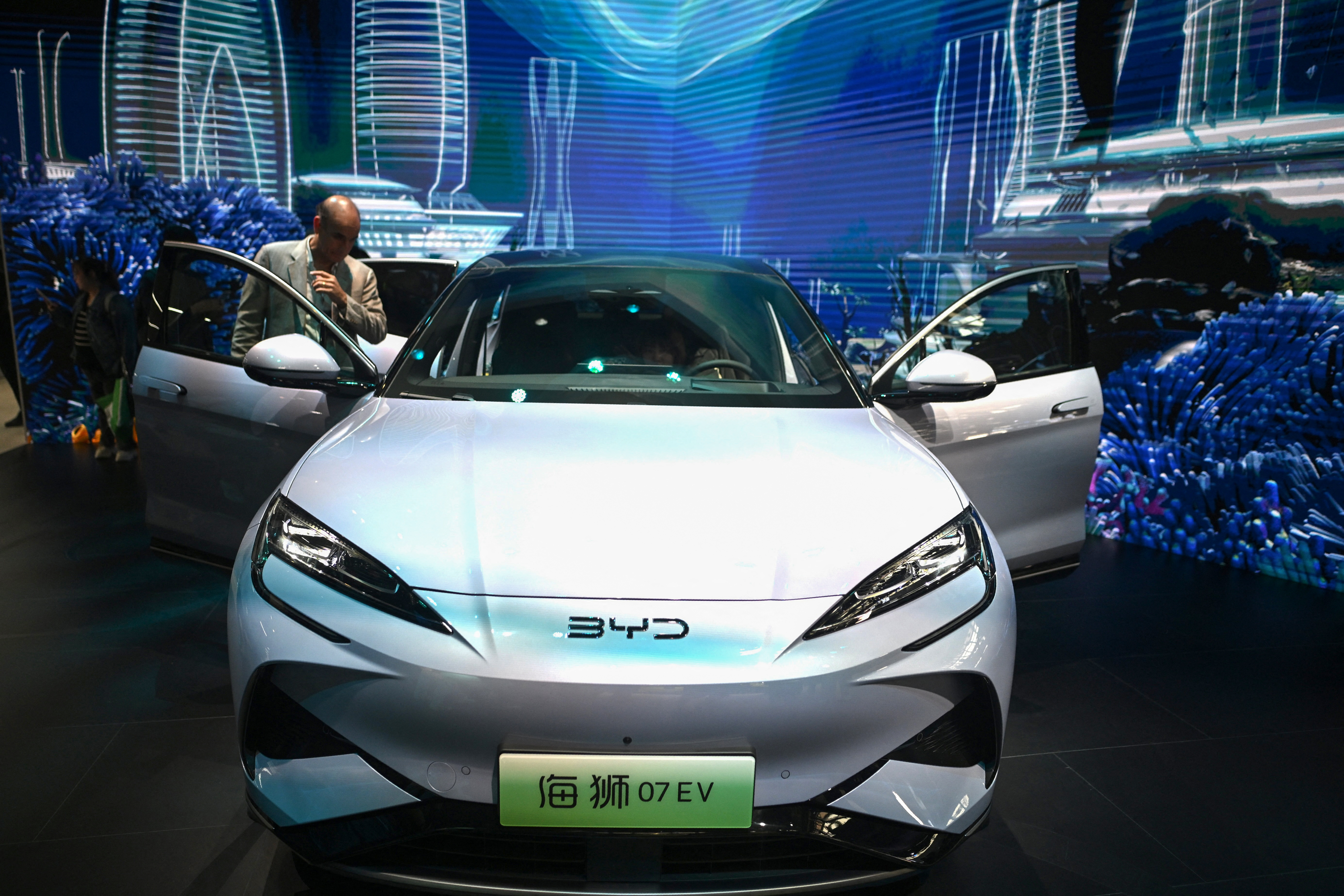 A BYD 07 EV model electric car is displayed at the Beijing Auto Show on April 25, 2024. (Photo by Pedro Pardo / AFP)