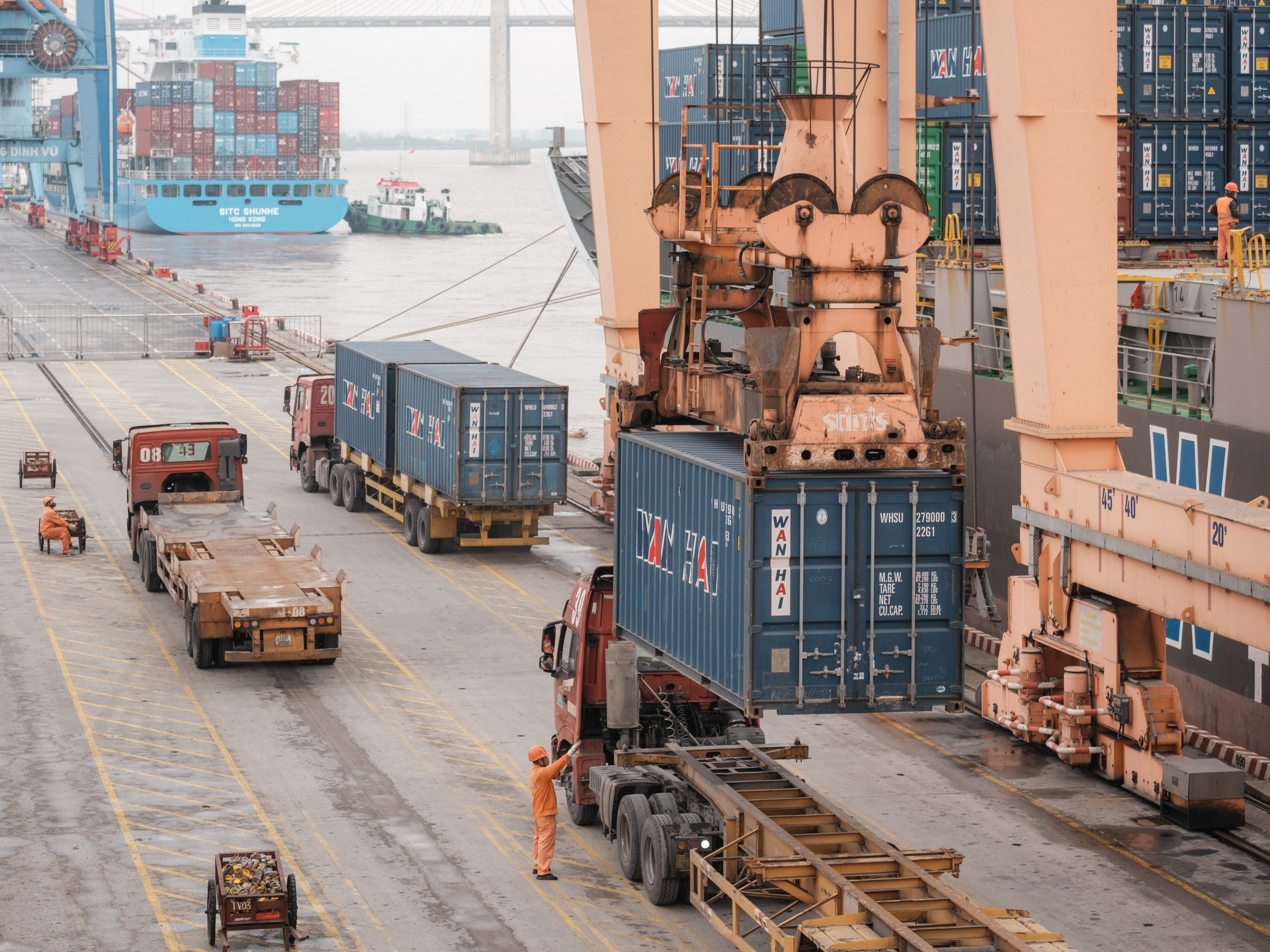A container is offloaded from the Wanhai 175 cargo ship at the Tan Vu Terminal, operated by Vietnam Maritime Corp., at Haiphong Port in Haiphong, Vietnam, on Wednesday, Jan. 15, 2025. Vietnam Maritime, the state-owned shipping, logistics and seaports company previously known as Vietnam National Shipping Lines or Vinalines, plans to expand its fleet by 20% annually in the next five years, Photographer: Linh Pham/Bloomberg