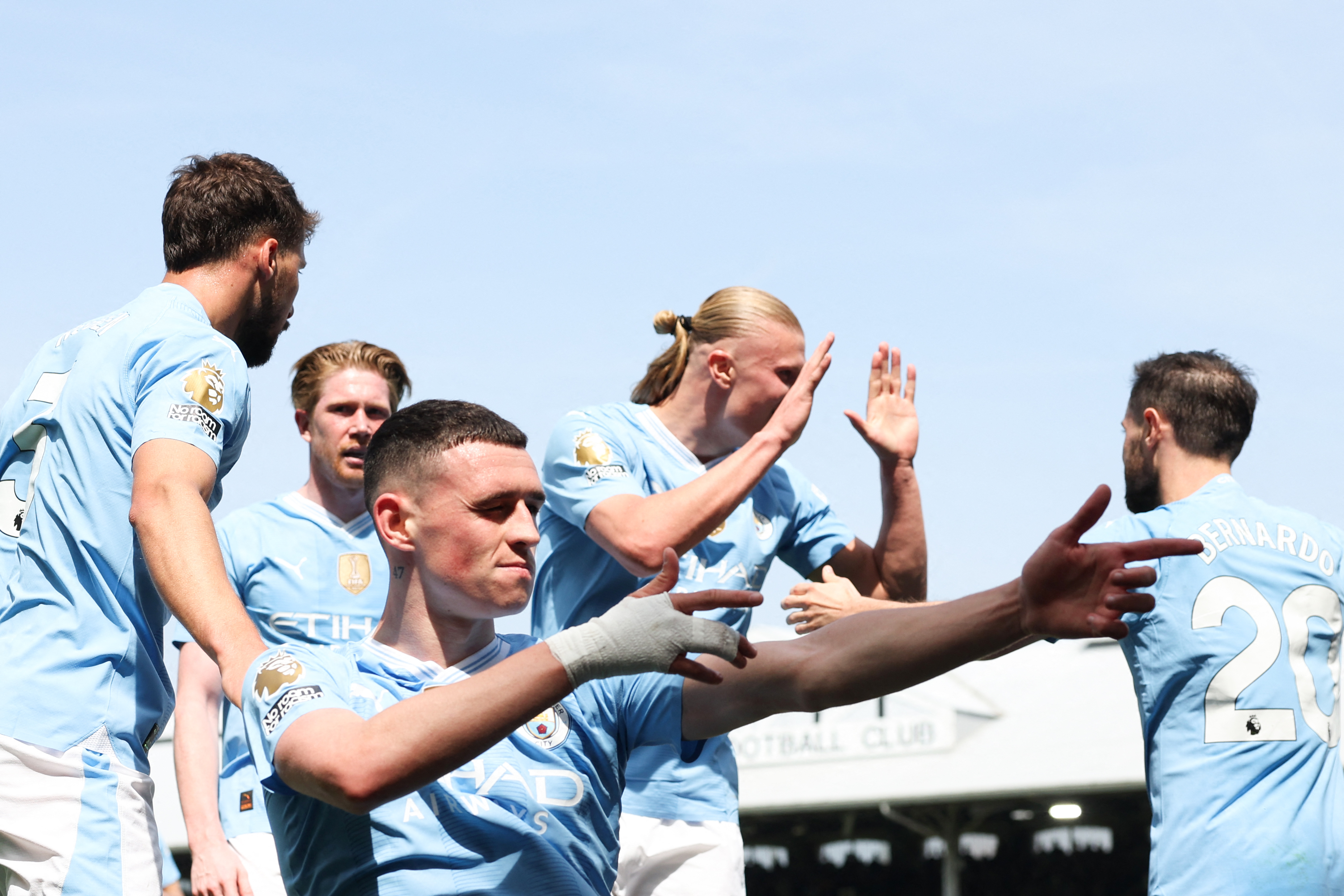 Manchester City's English midfielder #47 Phil Foden celebrates scoring the team's second goal during the English Premier League football match between Fulham and Manchester City at Craven Cottage in London on May 11, 2024. (Photo by Adrian DENNIS / AFP) / RESTRICTED TO EDITORIAL USE. NO USE WITH UNAUTHORIZED AUDIO, VIDEO, DATA, FIXTURE LISTS, CLUB/LEAGUE LOGOS OR 'LIVE' SERVICES. ONLINE IN-MATCH USE LIMITED TO 120 IMAGES. AN ADDITIONAL 40 IMAGES MAY BE USED IN EXTRA TIME. NO VIDEO EMULATION. SOCIAL MEDIA IN-MATCH USE LIMITED TO 120 IMAGES. AN ADDITIONAL 40 IMAGES MAY BE USED IN EXTRA TIME. NO USE IN BETTING PUBLICATIONS, GAMES OR SINGLE CLUB/LEAGUE/PLAYER PUBLICATIONS.