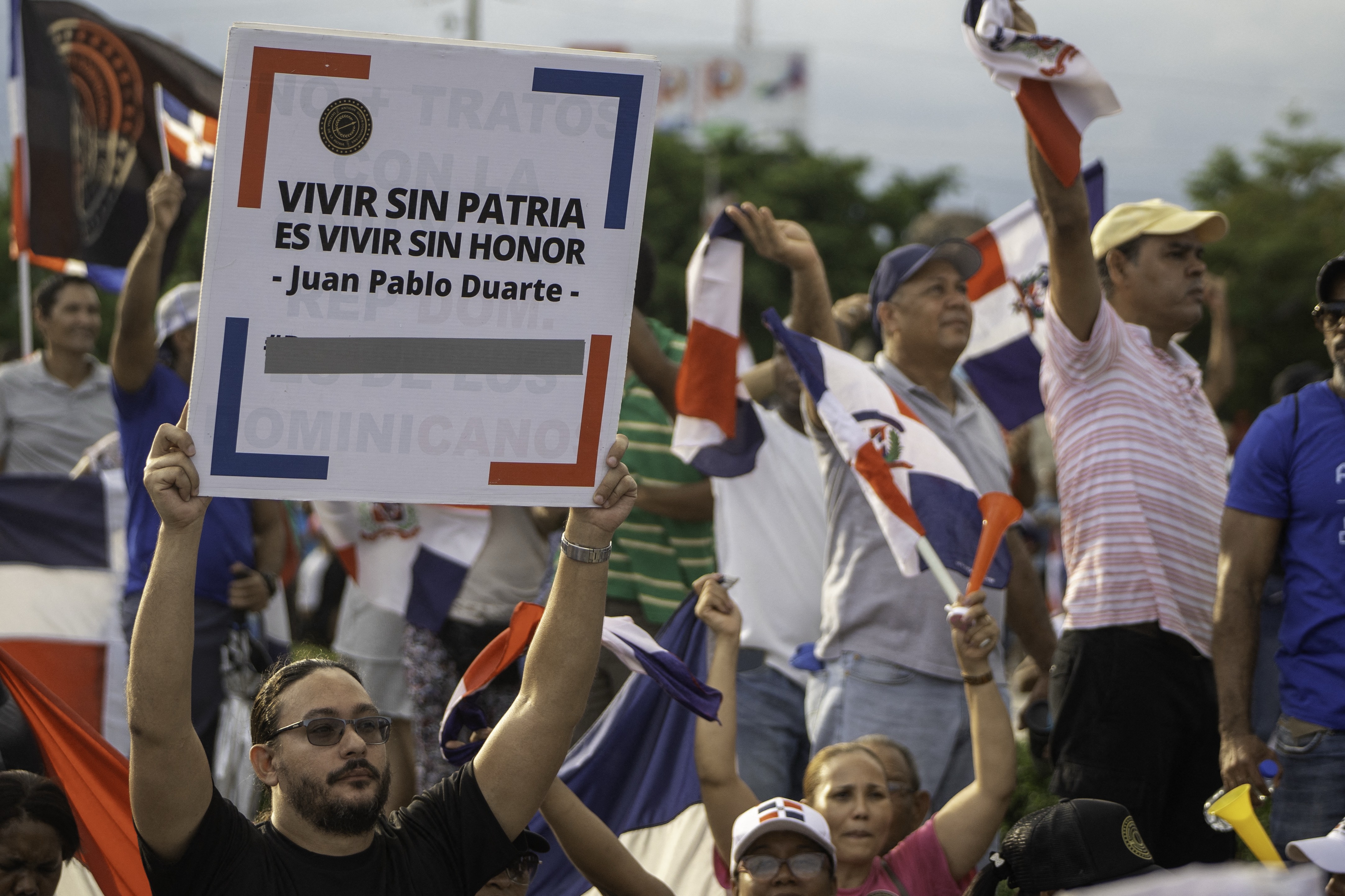 Demonstrators shout slogans during an anti-Haitian migration protest in Santo Domingo on October 5, 2024. (Photo by Francesco SPOTORNO / AFP)