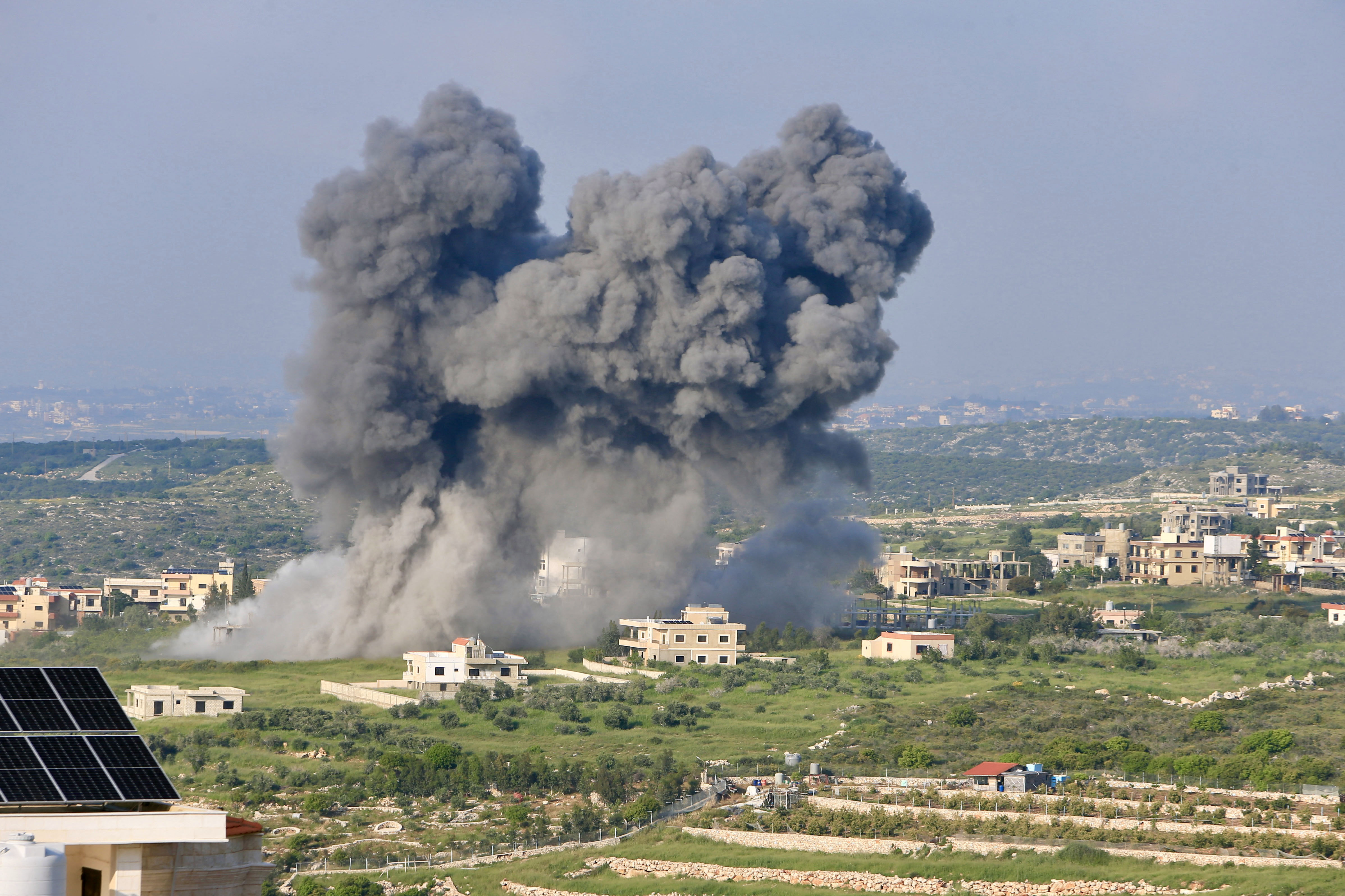 TOPSHOT - Smoke billows from the site of an Israeli airstrike on the southern Lebanese village of Majdel Zoun, on April 15, 2024, amid ongoing cross-border tensions as fighting continues between Israel and Palestinian Hamas militants in the Gaza Strip.