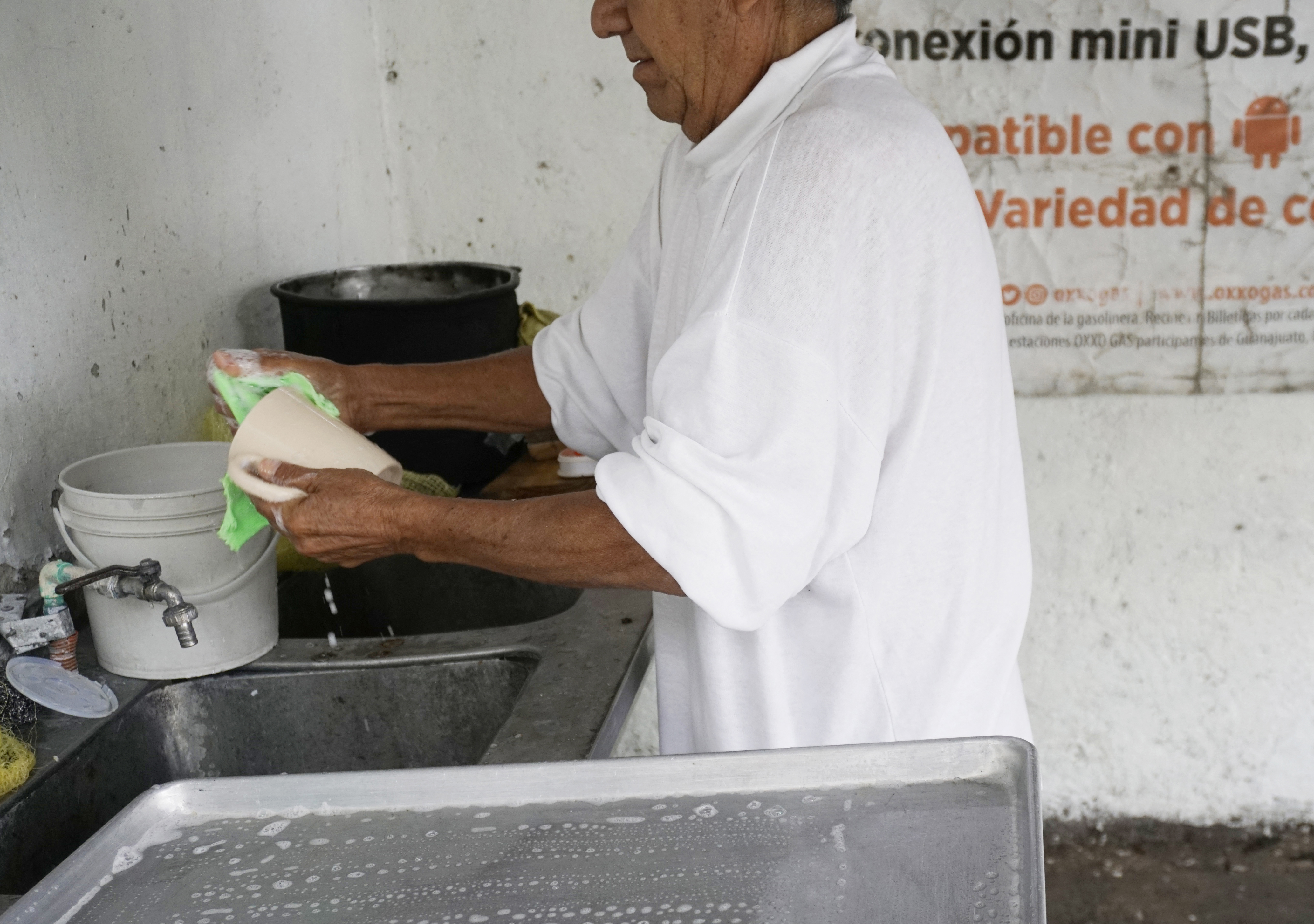An intern, who prefers to remain unnamed, works at the "Volver a Nacer" rehabilitation centre in Celaya, Guanajuato, Mexico, on June 20, 2025.