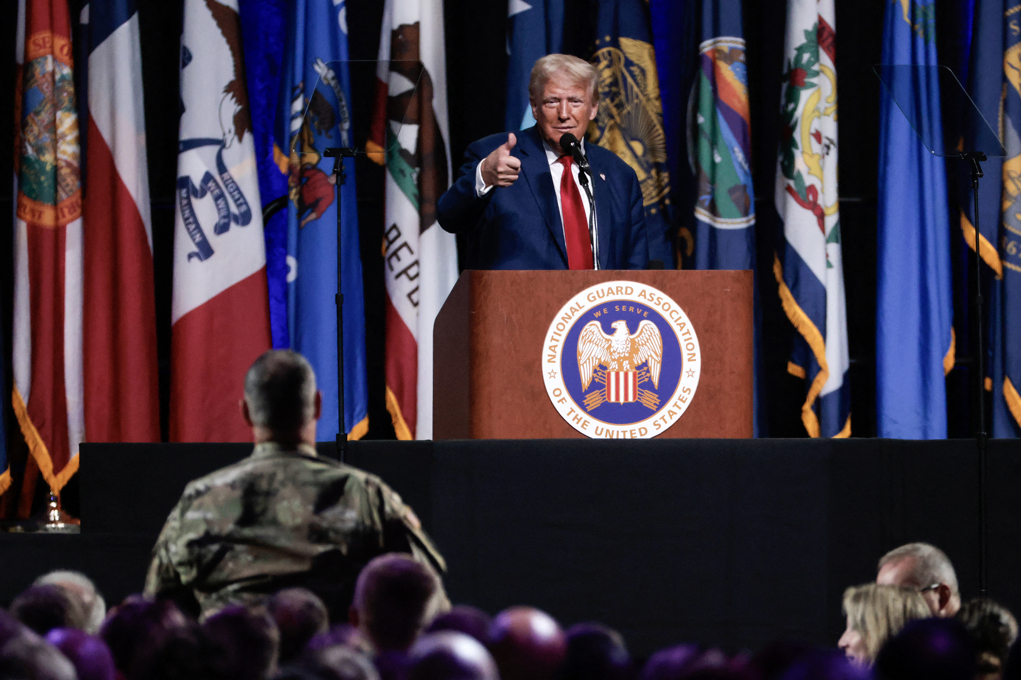 TOPSHOT - Former US President and 2024 Republican presidential candidate Donald Trump addresses the National Guard Association conference in Detroit, Michigan, on August 26, 2024. (Photo by JEFF KOWALSKY / AFP)