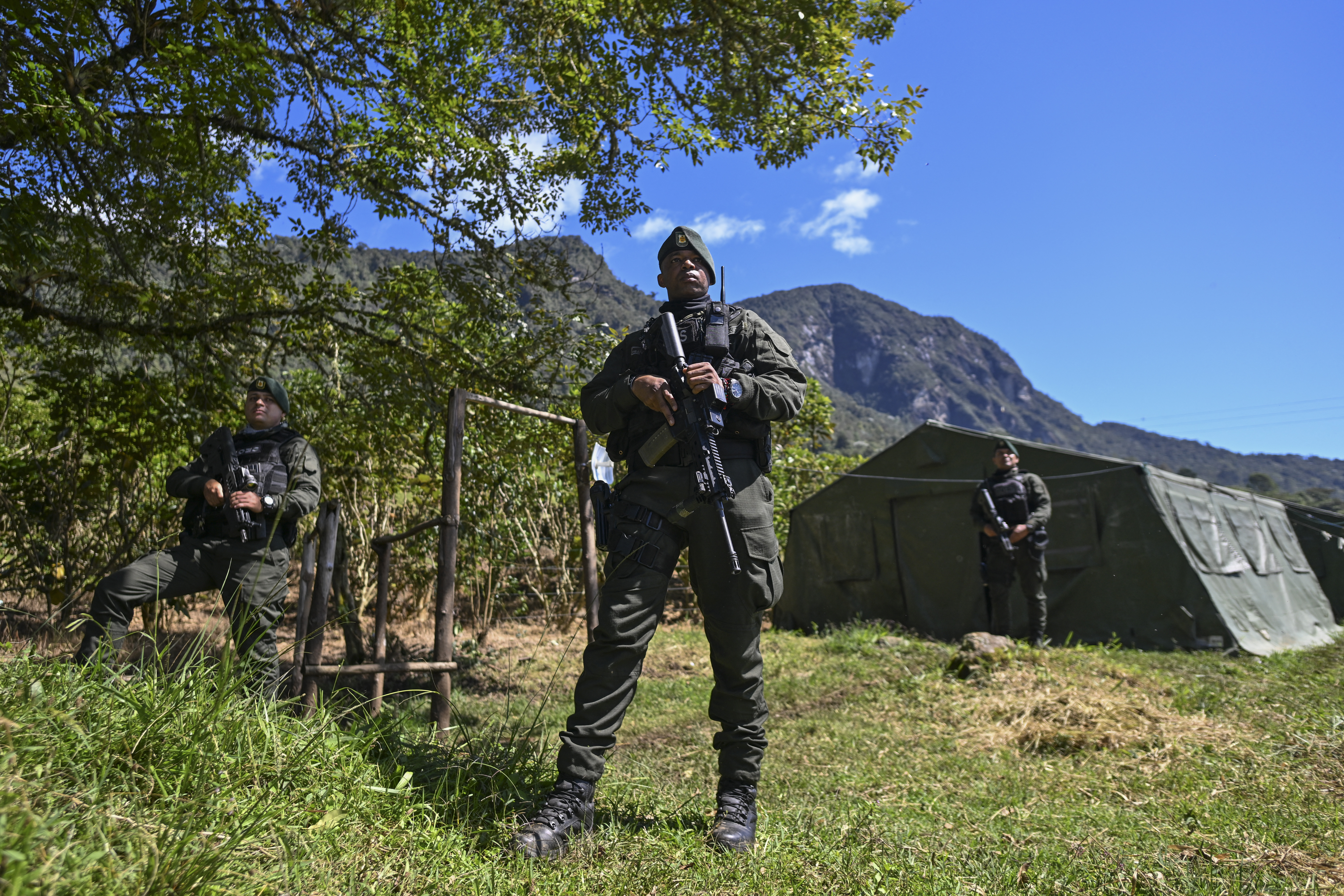 Colombian special forces policemen stand guard at Farallones de Cali National Natural Park in the outskirts of Cali, on July 6, 2024, during security operations ahead of the upcoming COP16 Summit.