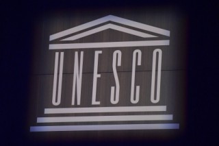 (FILES) This photograph shows the logo of UNESCO during the 75th anniversary celebrations of The United Nations Educational, Scientific and Cultural Organization (UNESCO) at UNESCO headquarters in Paris on November 12, 2021.