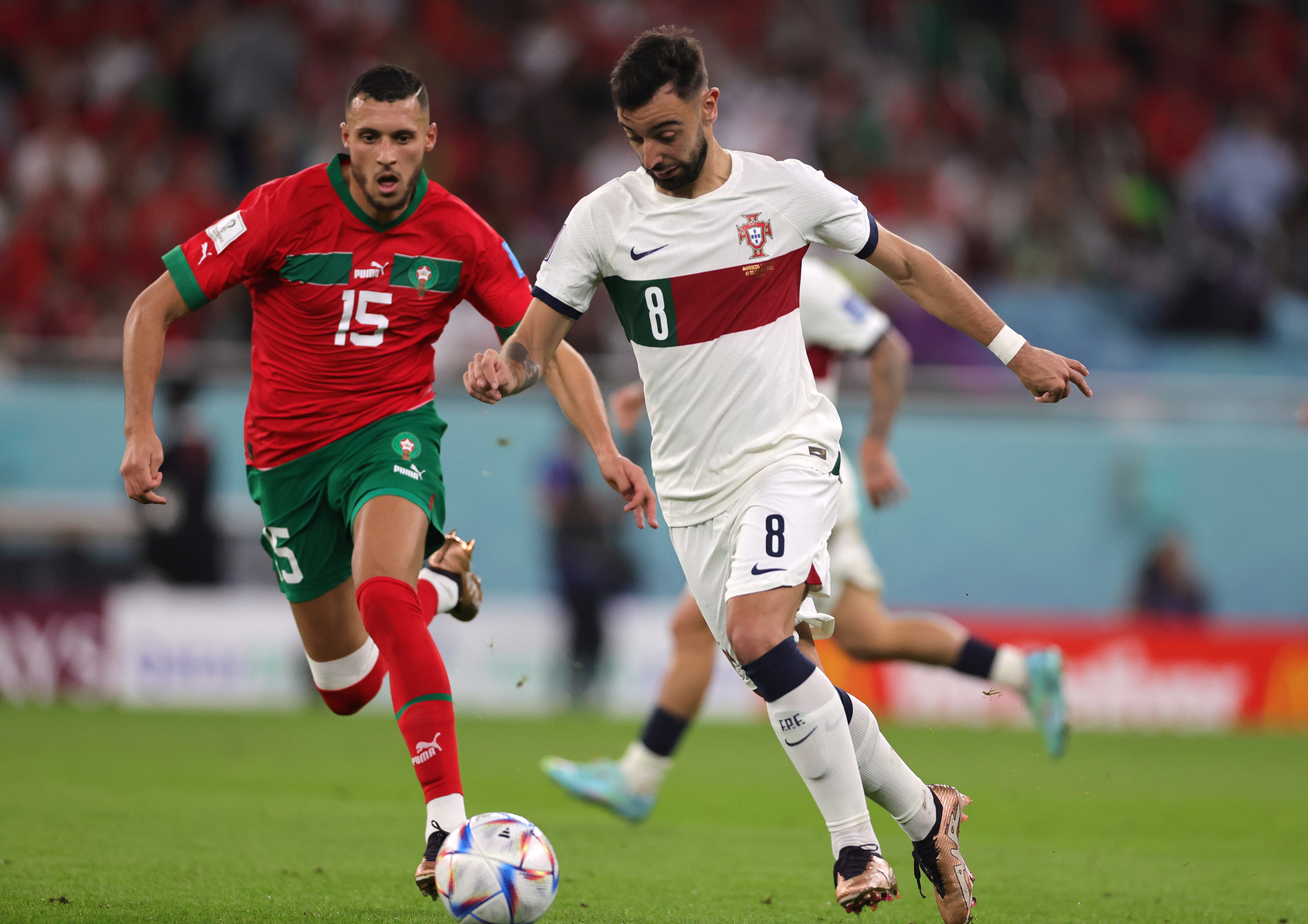 Doha (Qatar), 10/12/2022.- Selim Amallah (L) of Morocco in action against Bruno Fernandes of Portugal during the FIFA World Cup 2022 quarter final soccer match between Morocco and Portugal at Al Thumama Stadium in Doha, Qatar, 10 December 2022. (Mundial de Fútbol, Marruecos, Catar) EFE/EPA/Abir Sultan