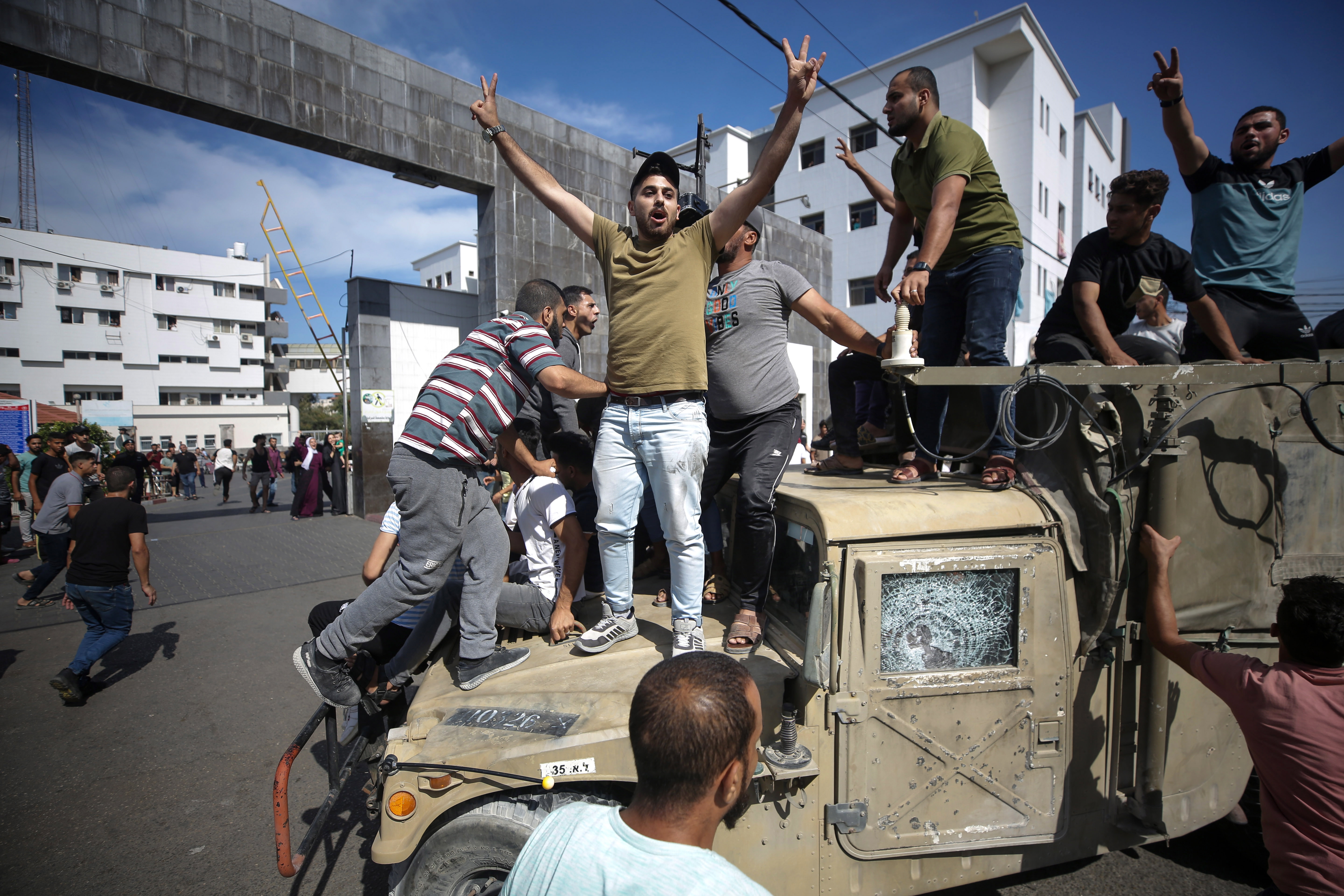 Gaza City (---), 07/10/2023.- Palestinians ride an Israeli military jeep in the streets of Gaza during the storming of Israeli settlements by militants of the Ezz Al-Din Al Qassam militia, the military wing of Hamas movement, Gaza city, 07 October 2023. Rocket barrages were launched from the Gaza Strip early Saturday in a surprise attack claimed by the Islamist movement Hamas. (tormenta) EFE/EPA/HAITHAM IMAD