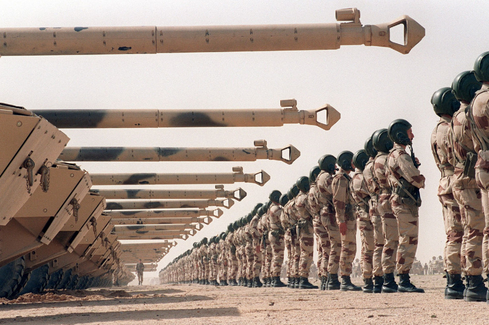 In this file photo taken on March 12, 1991, troops and AMX-10RC tanks of the French light-armoured Spahi regiment stand in formation during a departure ceremony in King Khaled Military City, some 100 kilometres south of the Iraqi border. Thirty years have passed since Iraqi tyrant Saddam Hussein invaded neighbouring Kuwait, but despite hints of a diplomatic rapprochement, people both countries say the wounds have yet to heal. On August 2, 1990, Saddam sent his military, already exhausted by an eight-year conflict with Iran, into Kuwait to seize what he dubbed "Iraq's 19th province." The two-day operation turned into a seven-month occupation and, for many Iraqis, opened the door to 30 years of devastation which is still ongoing. / AFP / ROMEO GACAD