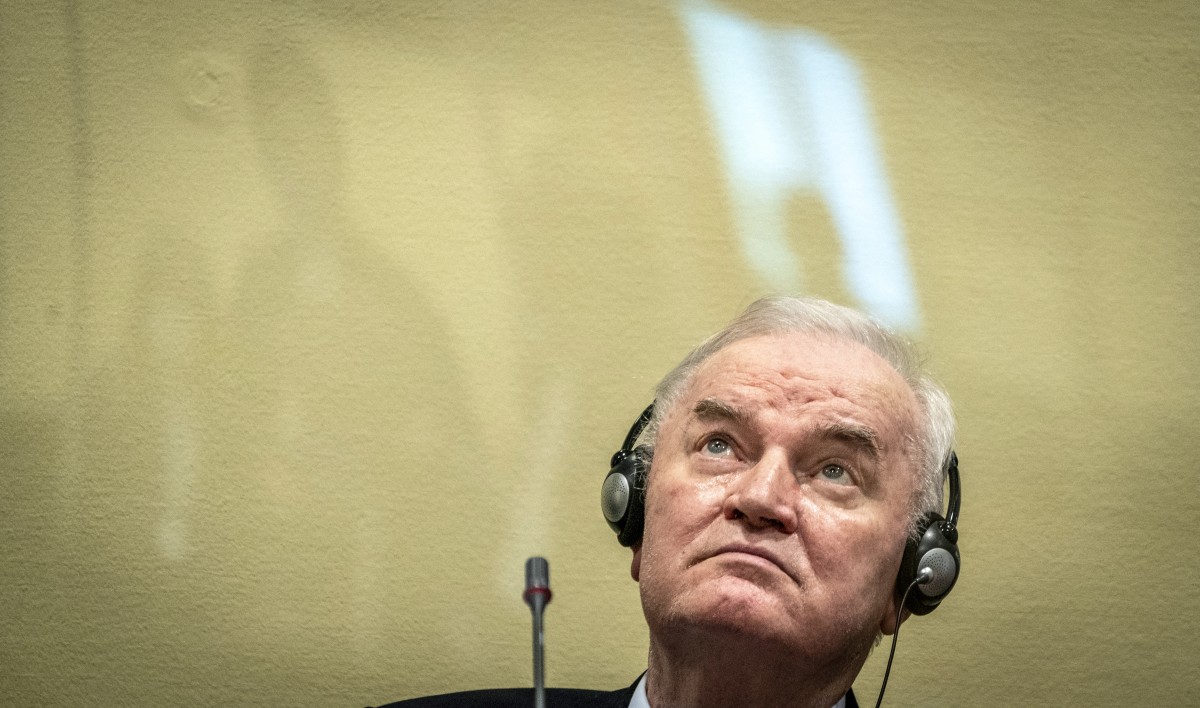 (FILES) Ex-Bosnian Serb military chief Ratko Mladic sits in the defendant box prior to the hearing of the final verdict on appeal against his genocide conviction over the 1995 Srebrenica massacre, Europe's worst act of bloodshed since World War II, on June 8, 2021 at the International Residual Mechanism for Criminal Tribunals (IRMCT) in The Hague.