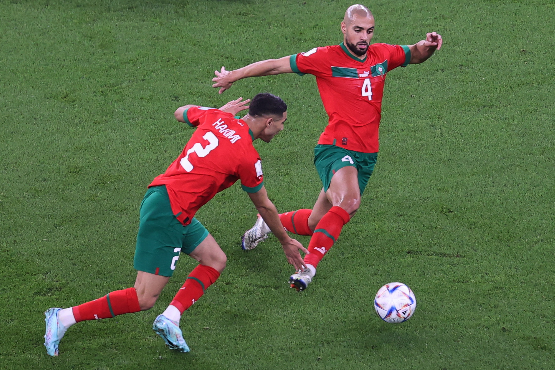 Doha (Qatar), 10/12/2022.- Achraf Hakimi (L) and Sofyan Amrabat of Morocco in action during the FIFA World Cup 2022 quarter final soccer match between Morocco and Portugal at Al Thumama Stadium in Doha, Qatar, 10 December 2022. (Mundial de Fútbol, Marruecos, Catar) EFE/EPA/Abedin Taherkenareh