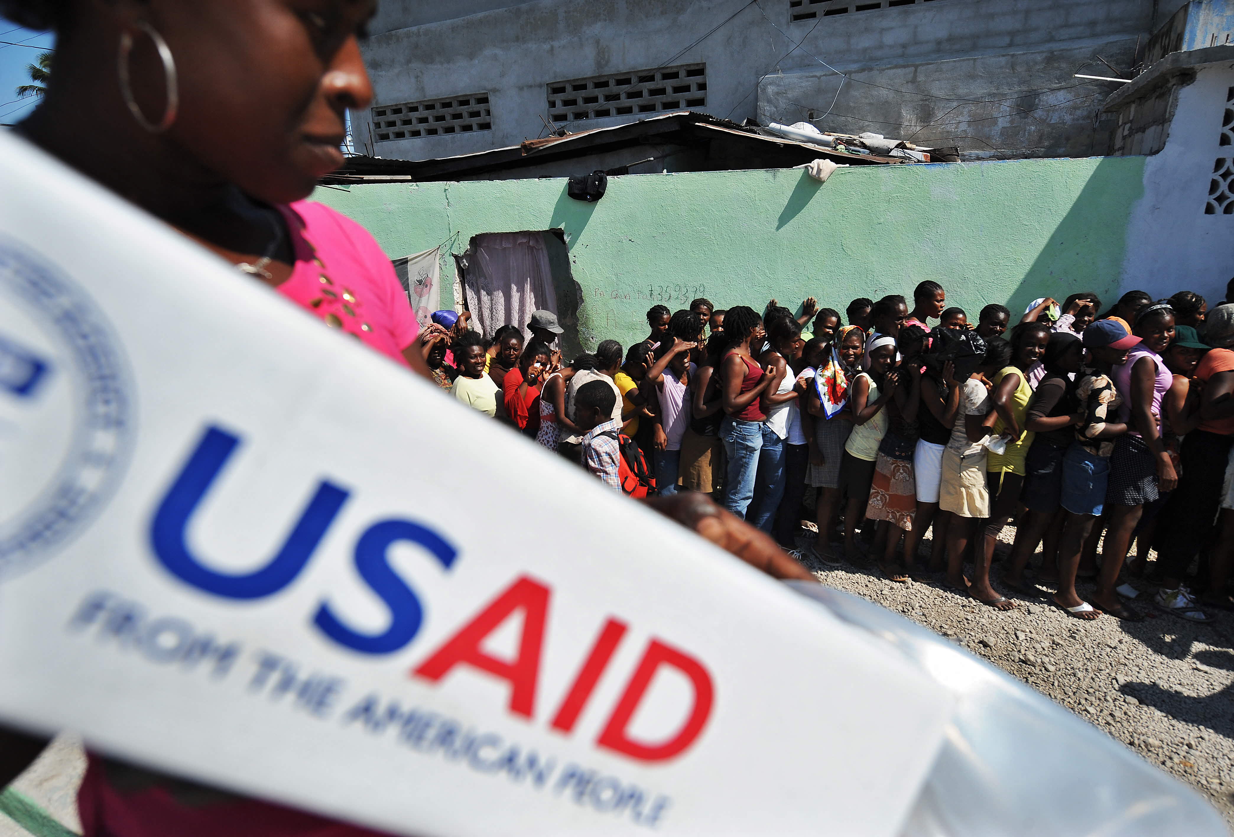 (FILES) People queue to receive items at a USAID distribution point in Port-au-Prince on January 23, 2010 following the massive 7.0-magnitude quake that shattered the country.