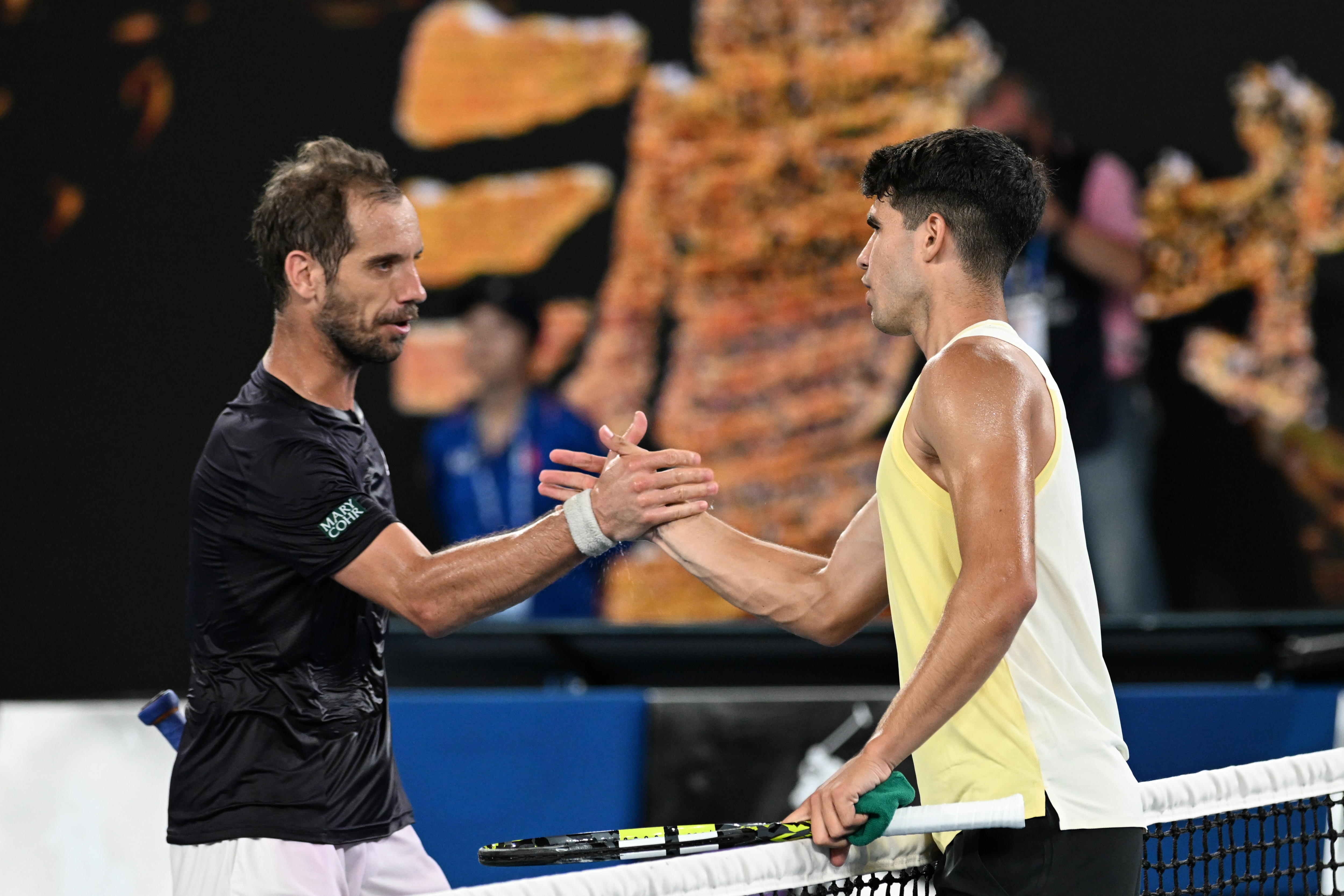 Melbourne (Australia), 16/01/2024.- Richard Gasquet of France congratulates Carlos Alcaraz of Spain on his win following their first round match on Day 3 of the 2024 Australian Open at Melbourne Park in Melbourne, Australia, 16 January 2024. (Tenis, Francia, España) EFE/EPA/LUKAS COCH AUSTRALIA AND NEW ZEALAND OUT