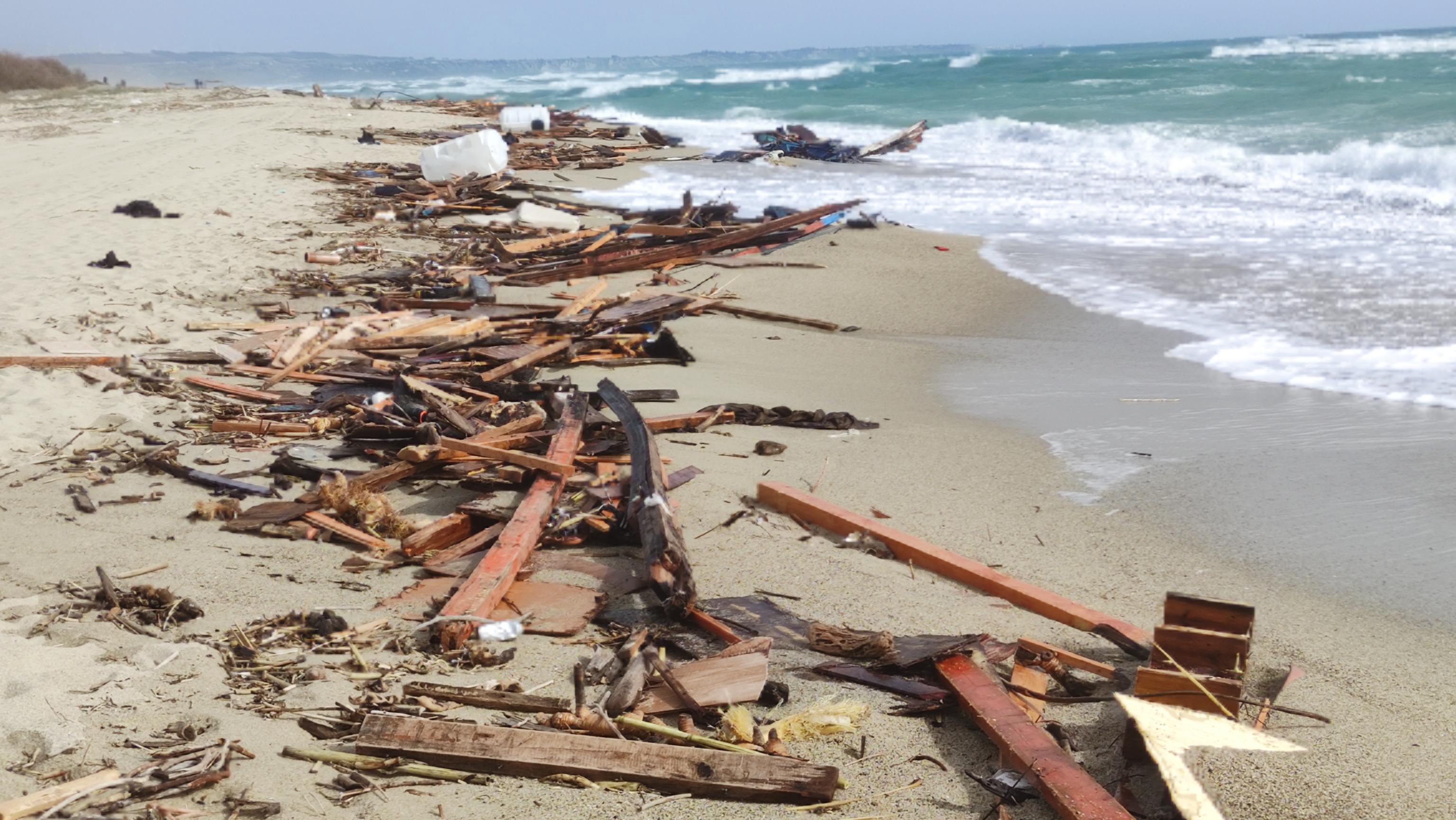Cutro (Italy), 26/02/2023.- Debris wash ashore following a shipwreck, at a beach near Cutro, Crotone province, southern Italy, 26 February 2023. Italian authorities recovered at least 40 bodies on the beach and in the sea near Crotone, in the southern Italian region of Calabria, after a boat carrying migrants sank in rough seas near the coast, ANSA reported on 26 February. About forty people survived the accident, Italian firefighters added. Authorities fear the death toll will climb as rescuers look for survivors. (Incendio, Italia) EFE/EPA/GIUSEPPE PIPITA