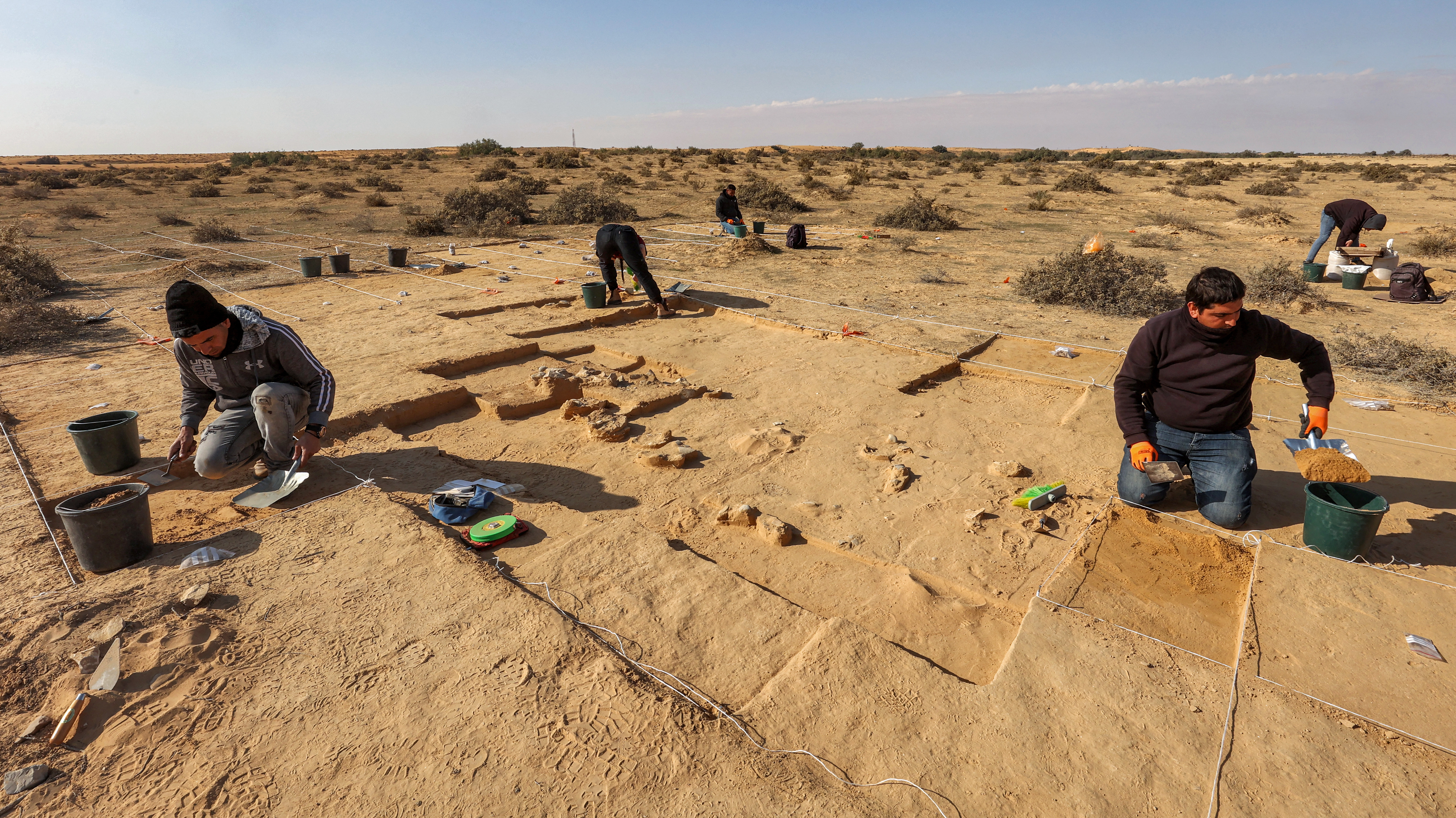 This picture taken on January 12, 2023 shows a view of discovered ostrich egg fragments dating over 4000 years discovered by the Israel Antiquities Authority (IAA) at a site in the dunes near Nitzana along the Israel-Egypt border in the western Negev desert. - Experts say the finds provide insight into the life of the ancient peoples inhabiting the region. The eight crushed eggs were located at a camp site used by nomads "since prehistoric times," said Lauren Davis, the Israel Antiquities Authority excavation director. Their proximity to the fire, alongside stones, flint, tools and pottery sherds, implies that the eggs were to be cooked, said Davis. (Photo by GIL COHEN-MAGEN / AFP)