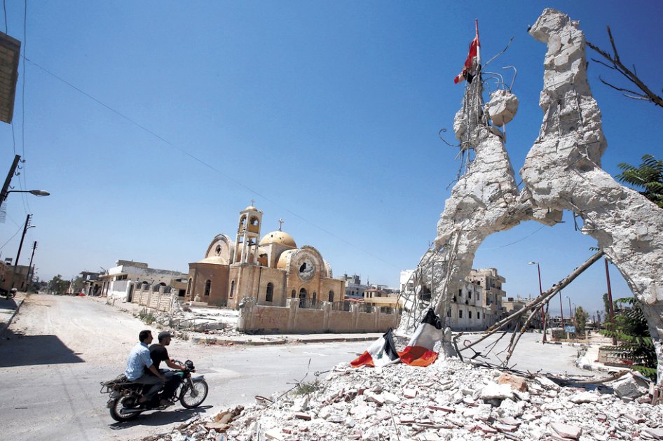 Imagen de una de las esquinas de Qusayr, captada en agosto de este año. Gran parte de la ciudad está en escombros.   / AFP