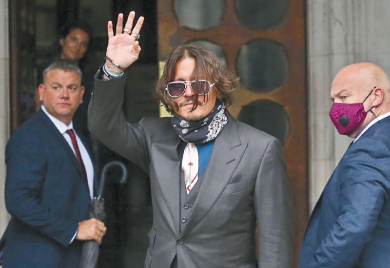 US actor Johnny Depp arrives on the second day of his libel trial against News Group Newspapers (NGN), at the High Court in London, on July 8, 2020. Depp is suing the publishers of The Sun and the author of the article for the claims that called him a "wife-beater" in April 2018. / AFP / ISABEL INFANTES