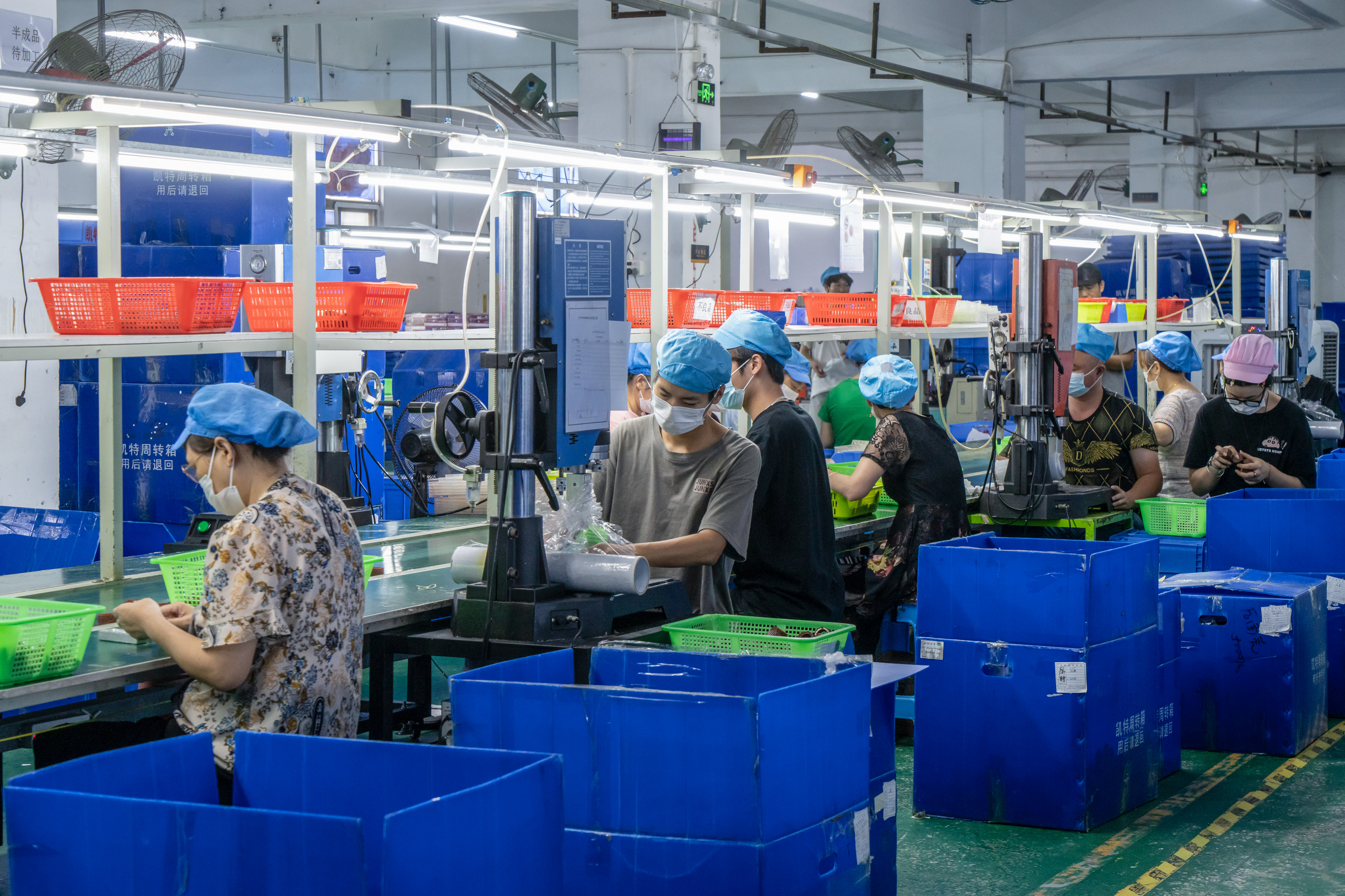 Workers on the production line of a toy factory in Shenzhen, China. Photographer: Qilai Shen/Bloomberg