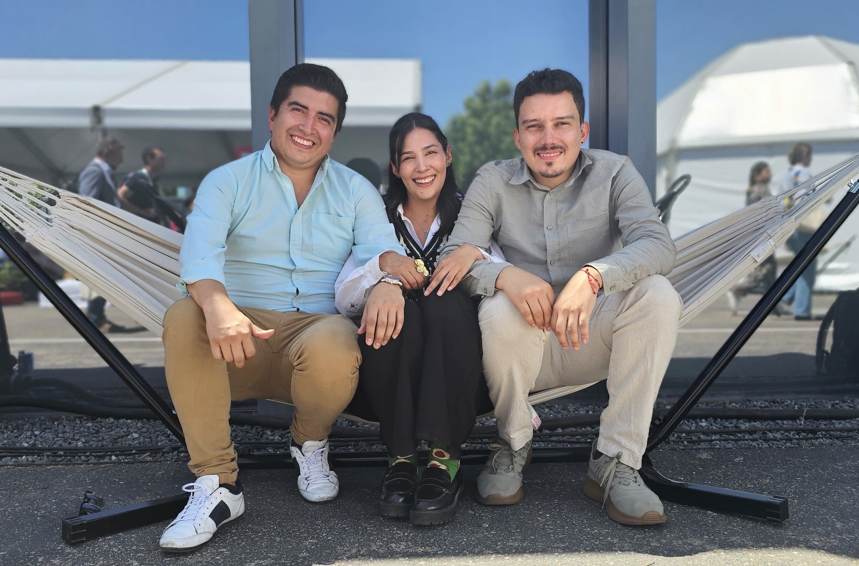 Miguel, Venus y Felipe en uno de los espacios del South Summit, en Madrid, España.