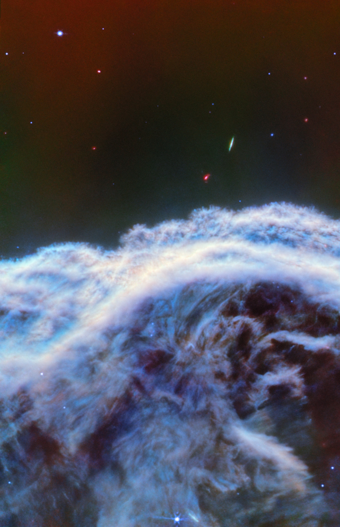 This handout image obtained April 29, 2024 courtesy of NASA/ESA/CSA shows the “mane” of the Horsehead Nebula imaged by Webb’s MIRI instrument.