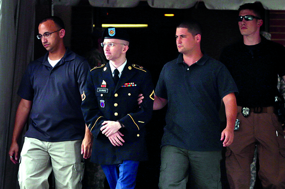 FORT MEADE, MD - JULY 25: U.S. Army Private First Class Bradley Manning (2nd L) is escorted by military police as he leaves after the first day of closing arguments in his military trial July 25, 2013 Fort George G. Meade, Maryland. Manning, who is charged with aiding the enemy and wrongfully causing intelligence to be published on the internet, is accused of sending hundreds of thousands of classified Iraq and Afghanistan war logs and more than 250,000 diplomatic cables to the website WikiLeaks while he was working as an intelligence analyst in Baghdad in 2009 and 2010.   Chip Somodevilla/Getty Images/AFP