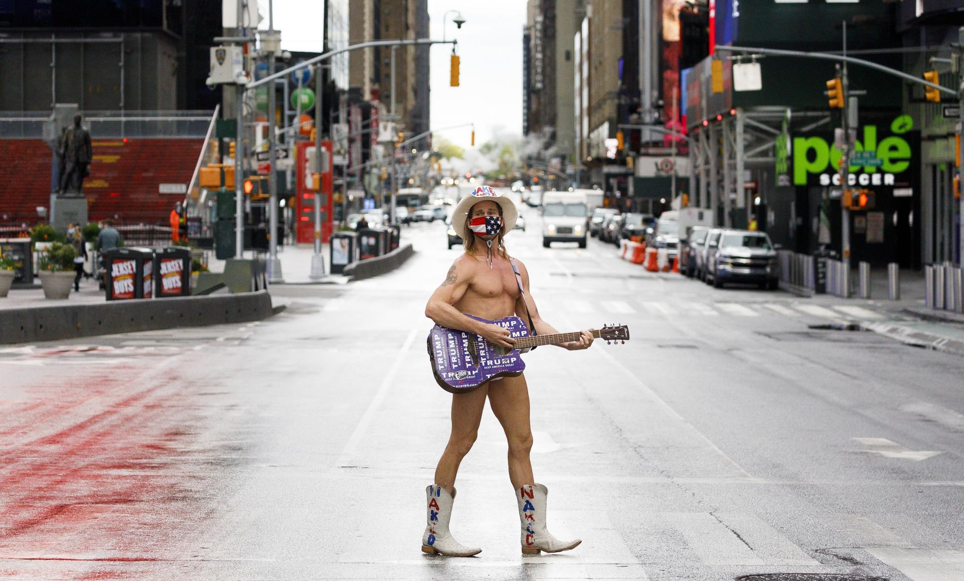NEW YORK (United States), 03/07/2026.- (FILE) - A busker named Robert Burck, known as the Naked Cowboy, stands in the middle of a quiet Times Square in New York, New York, USA, 11 May 2020 (reissued on 03 July 2026). US marks 2026 the 250th anniversary of America, known as the Semiquincentennial or SemiQuin, marks 250 years since the adoption of the Declaration of Independence on 04 July 1776. (Nueva York) EFE/EPA/JUSTIN LANE
