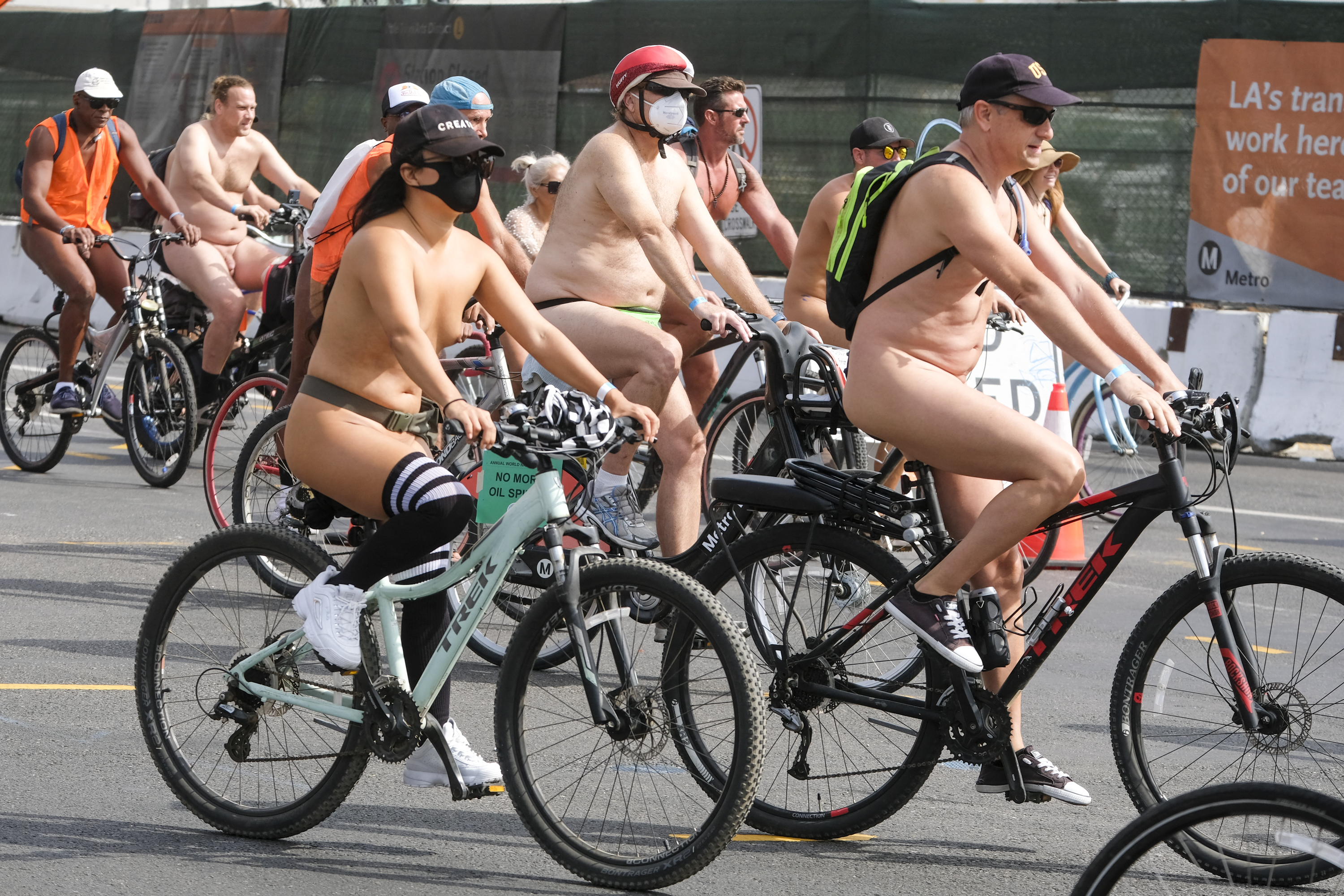 EDITORS NOTE: Graphic content / Nude cyclists get ready for the World Naked Bike Ride on September 18, 2021 in downtown Los Angeles. (Photo by RINGO CHIU / AFP)