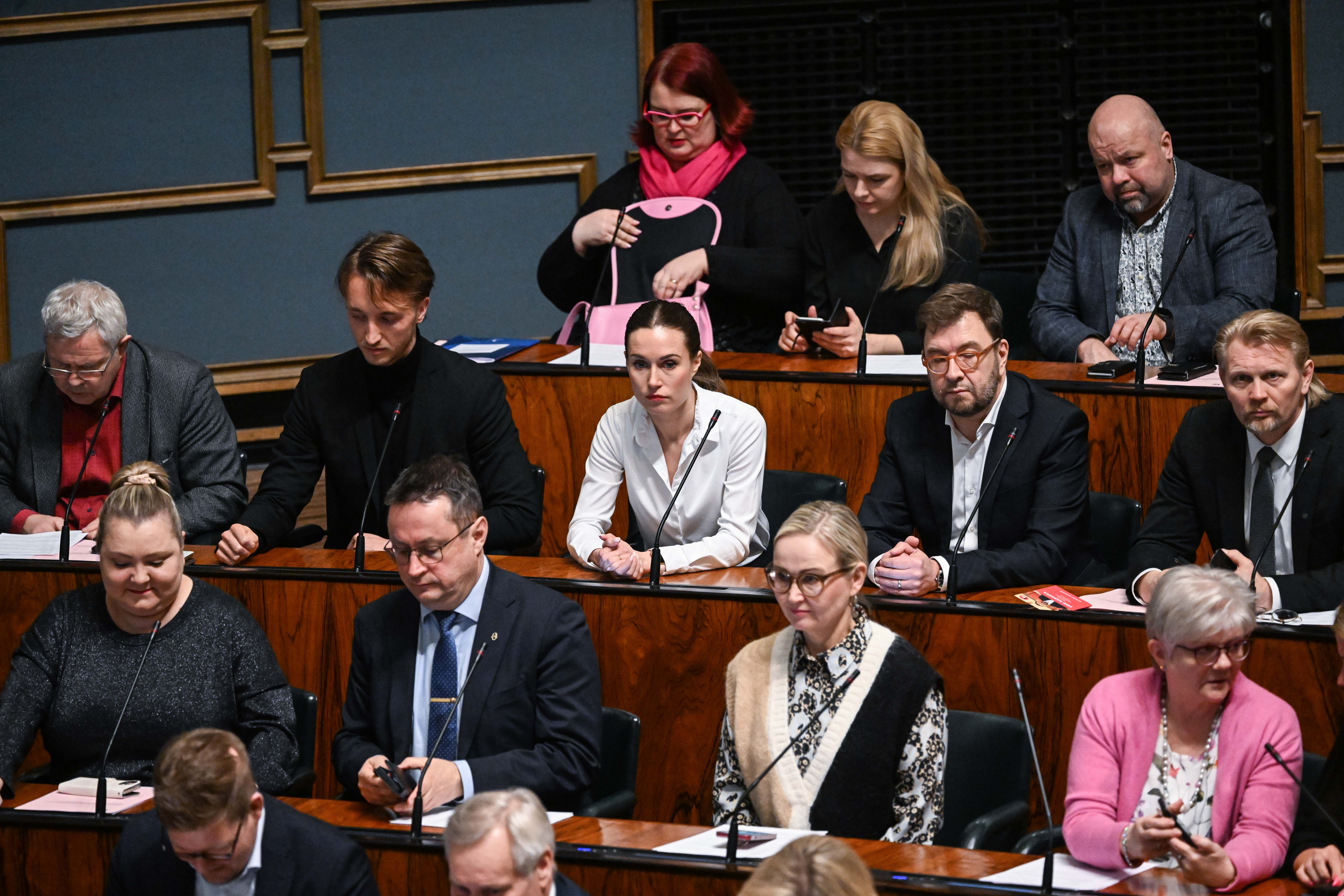 Helsinki (Finland), 01/03/2023.- Finland's Prime Minister Sanna Marin (C) attends Parliament's plenary session with a vote on Finland's accession to NATO in Helsinki, Finland, 01 March 2023. The Finnish Parliament approved on the day the government proposal on Finland's accession to NATO by a vote of 184-7. (Finlandia) EFE/EPA/KIMMO BRANDT