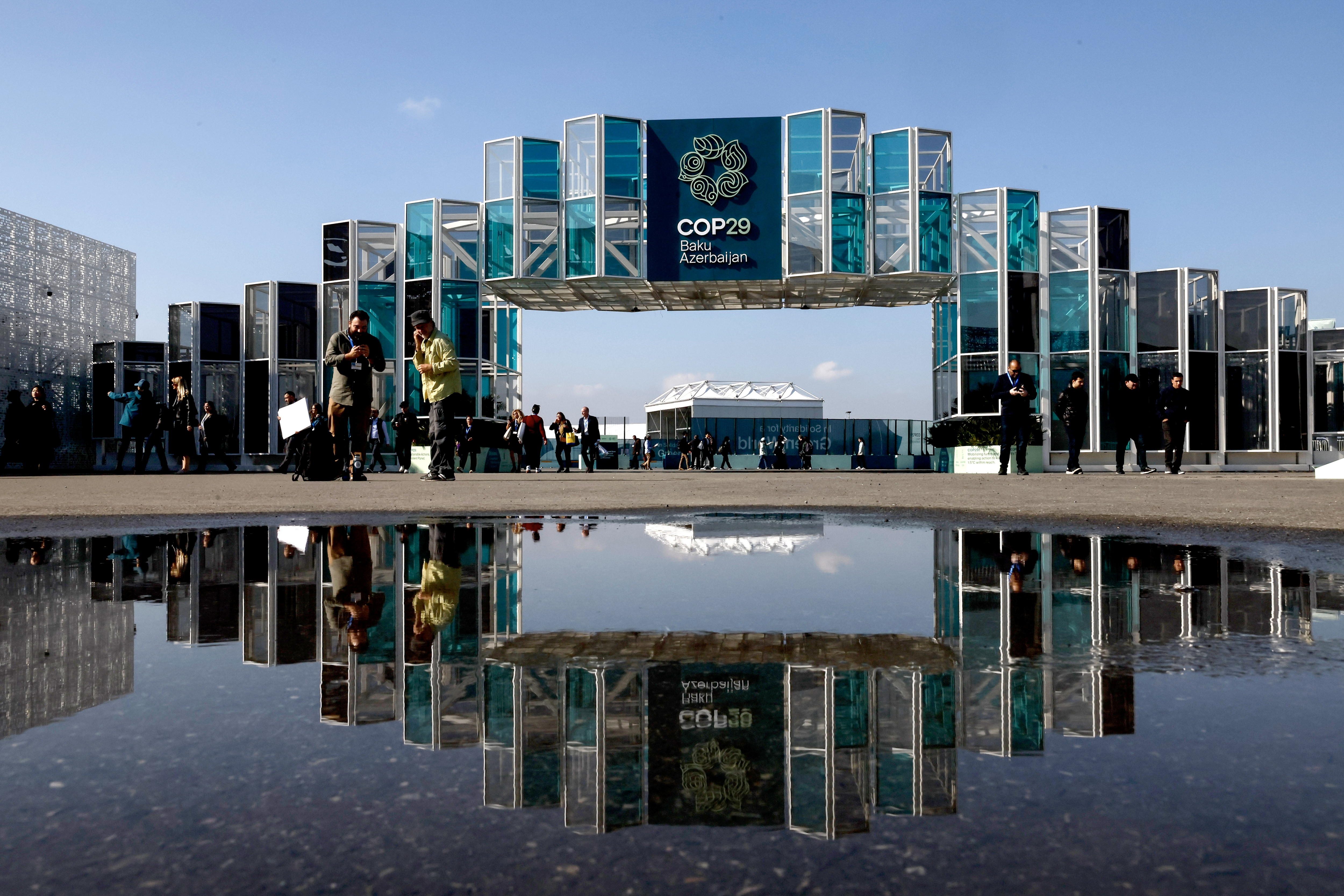 Baku (Azerbaijan), 10/11/2024.- The entrance gateway for guests is reflected in a puddle outside the venue of the UN Climate Change Conference COP29 in Baku, Azerbaijan, 10 November 2024. The Azerbaijani capital of Baku will host the 2024 United Nations Climate Change Conference (COP29) from 11 to 22 November 2024. (Azerbaiyán) EFE/EPA/ANATOLY MALTSEV