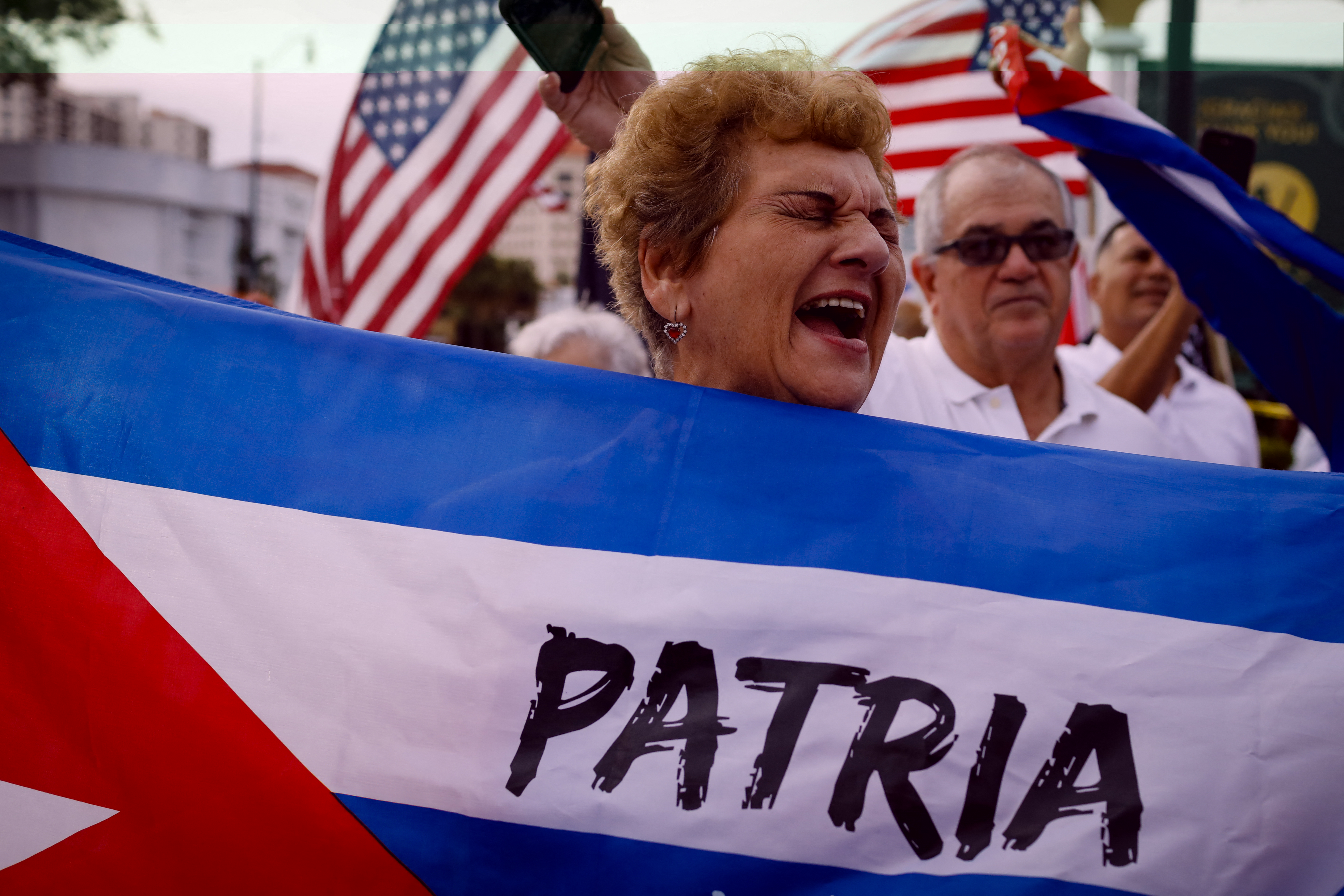 Demonstrators rally in Miami to support Cuban anti-government protesters, on November 14, 2021. - The US urged Cuban authorities on Sunday to lift a ban on protests ahead of planned anti-government demonstrations, the State Department said in a statement. Cuba's opposition has called for demonstrations in Havana and six provinces on November 15, which have been prohibited by the communist authorities, to call for the release of political prisoners. (Photo by Eva Marie UZCATEGUI / AFP)