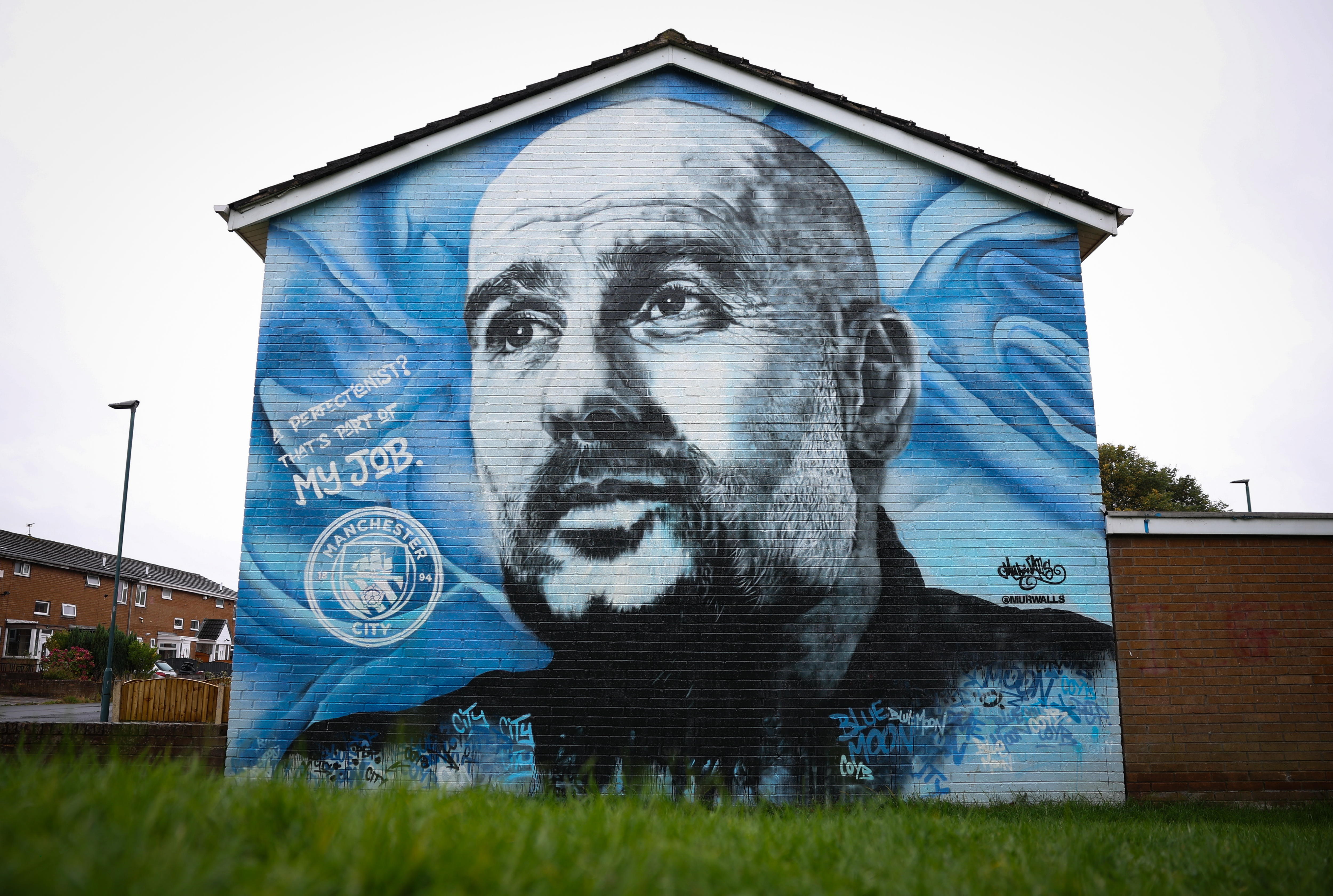 Manchester (United Kingdom), 15/09/2024.- A mural of Manchester City manager Pep Guardiola near to the Etihad Stadium in Manchester, Britain, 15 September 2024. An independent hearing is set to begin on 16 September 2024 assessing over 100 alleged breaches of Premier League financial rules by Manchester City between 2009 and 2023. Manchester City have denied all charges, which allege that they failed to provide accurate financial information and to properly disclose player and manager payments over a period of nine seasons, that they did not comply with UEFA financial fair play regulation over a period of five years, that they breached Premier League profit and sustainability rules over three season and that they failed to cooperate with Premier League investigations. If found guilty Manchester City could face fines, a points deduction or even suspension or expulsion from the Premier League. (Reino Unido) EFE/EPA/ADAM VAUGHAN