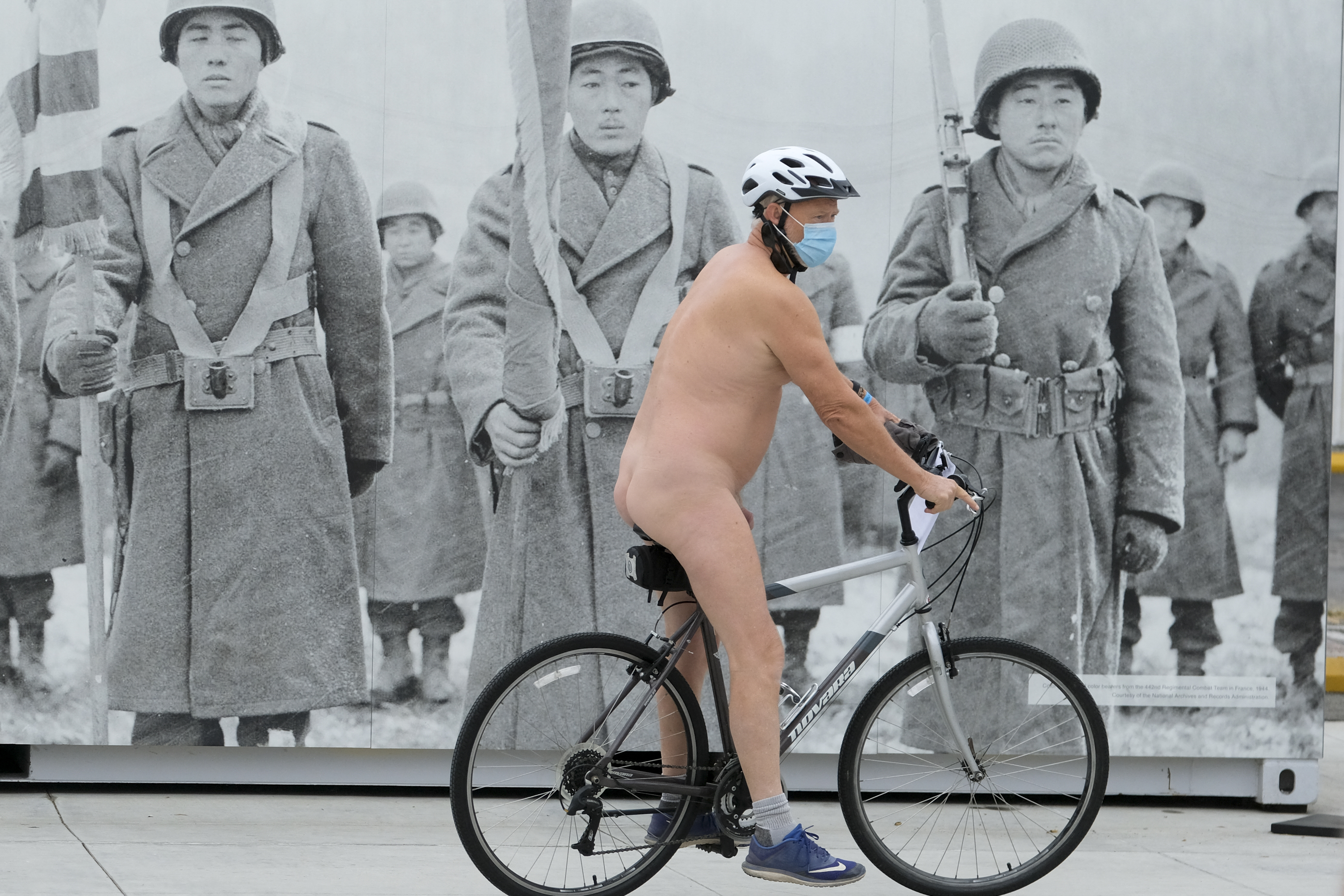 EDITORS NOTE: Graphic content / Nude cyclists get ready for the World Naked Bike Ride on September 18, 2021 in downtown Los Angeles. (Photo by RINGO CHIU / AFP)