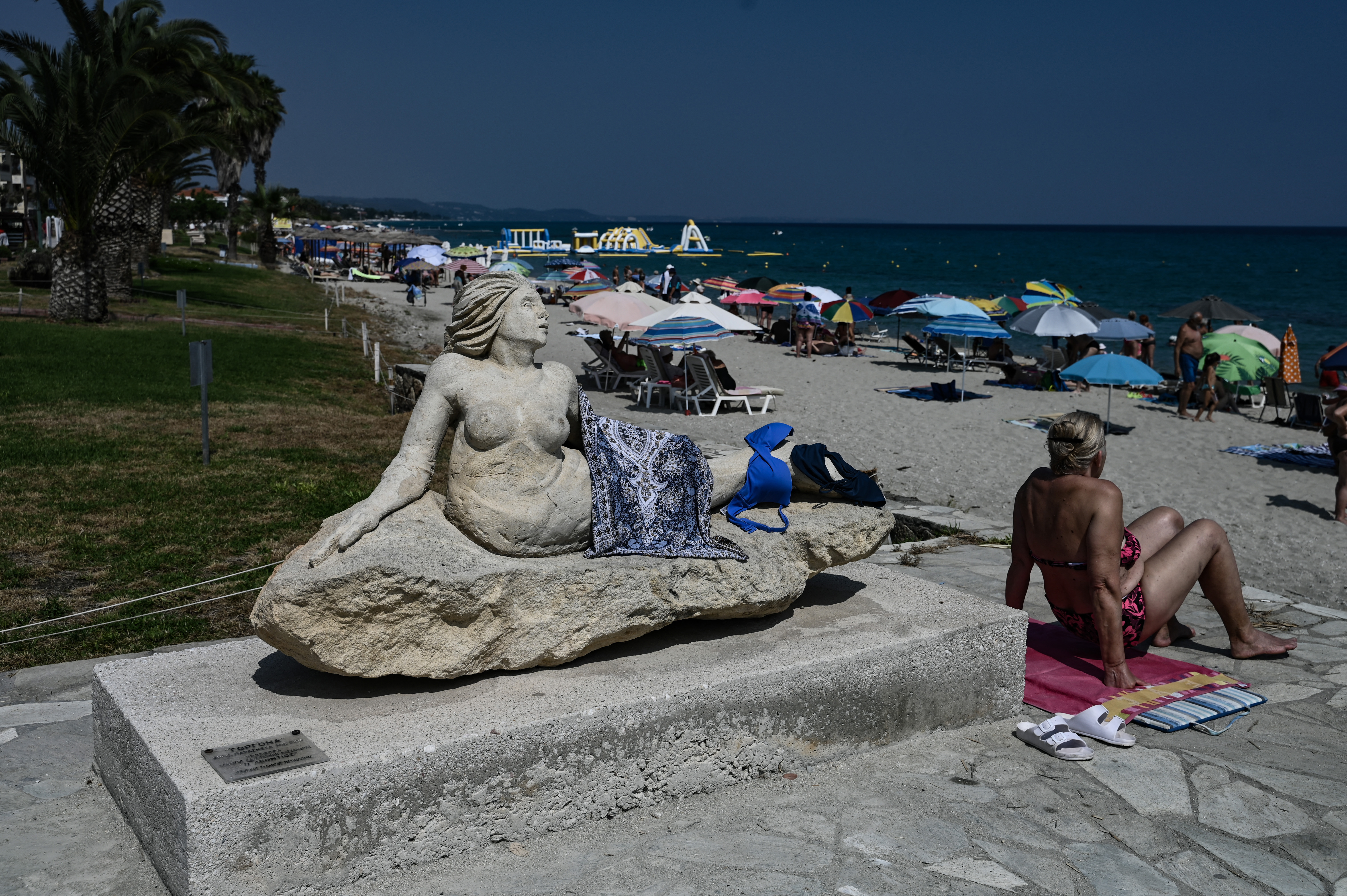 A women sunbathes close to a beach on the Halkidiki Peninsula, northern Greece on June 13, 2025.
