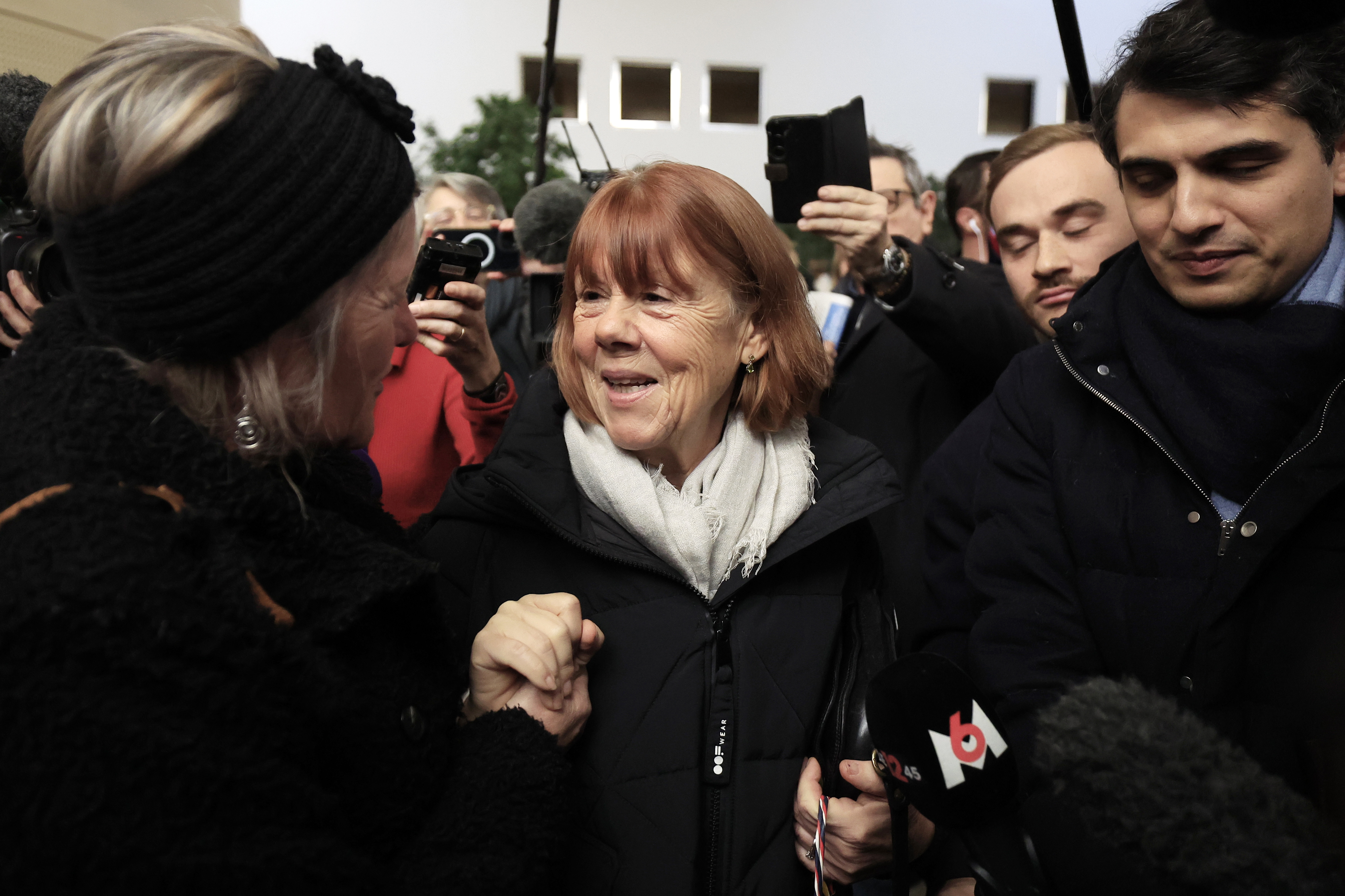 Avignon (France), 16/12/2024.- Gisele Pelicot (C), escorted by her lawyer Stephane Babonneau (R), leaves the criminal court where her ex-husband Dominique Pelicot stands trial, in Avignon, South of France, 16 December 2024. Dominique Pelicot is accused of drugging and raping his then-wife, Gisele Pelicot. He is also accused of inviting dozens of men to rape her while she was unconscious at their home in Mazan, France, between 2011 and 2020. Fifty other men are facing trial for their alleged involvement. Dominique Pelicot could face a maximum sentence of 20 years in prison if convicted. (Francia) EFE/EPA/Guillaume Horcajuelo