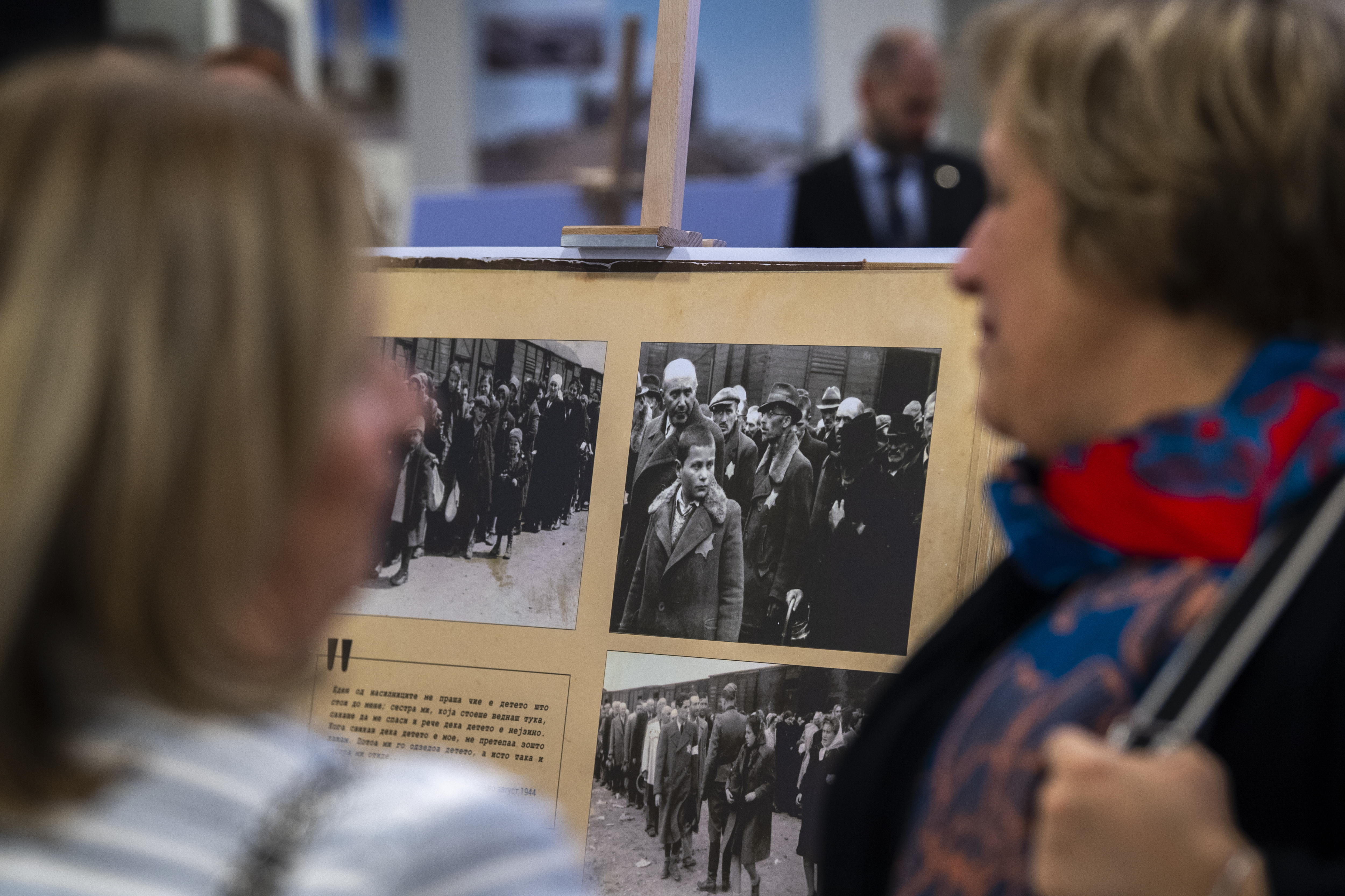 Skopje (Republic Of North Macedonia), 25/01/2024.- Visitors view the exhibition of documentary photographs from the Nazi concentration camp Auschwitz in the Holocaust Museum in Skopje, Republic of North Macedonia, 25 January 2024. On the occasion of January 27 - the International Day of Remembrance of the Victims of the Holocaust, the Holocaust Fund of the Jews of Macedonia organized the exhibition 'Auschwitz - A Place on Earth: An Album with Photographs from Auschwitz'. EFE/EPA/GEORGI LICOVSKI