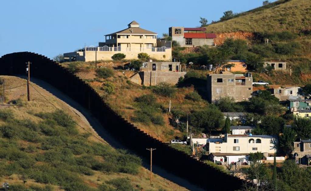 Along the U.S.- Mexico border fence