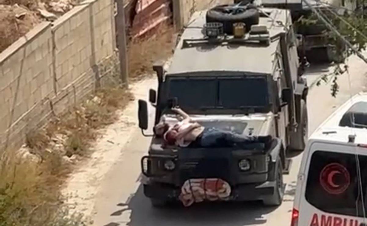 Imágenes de palestino atado al capó de un vehículo militar israelí desatan indignación