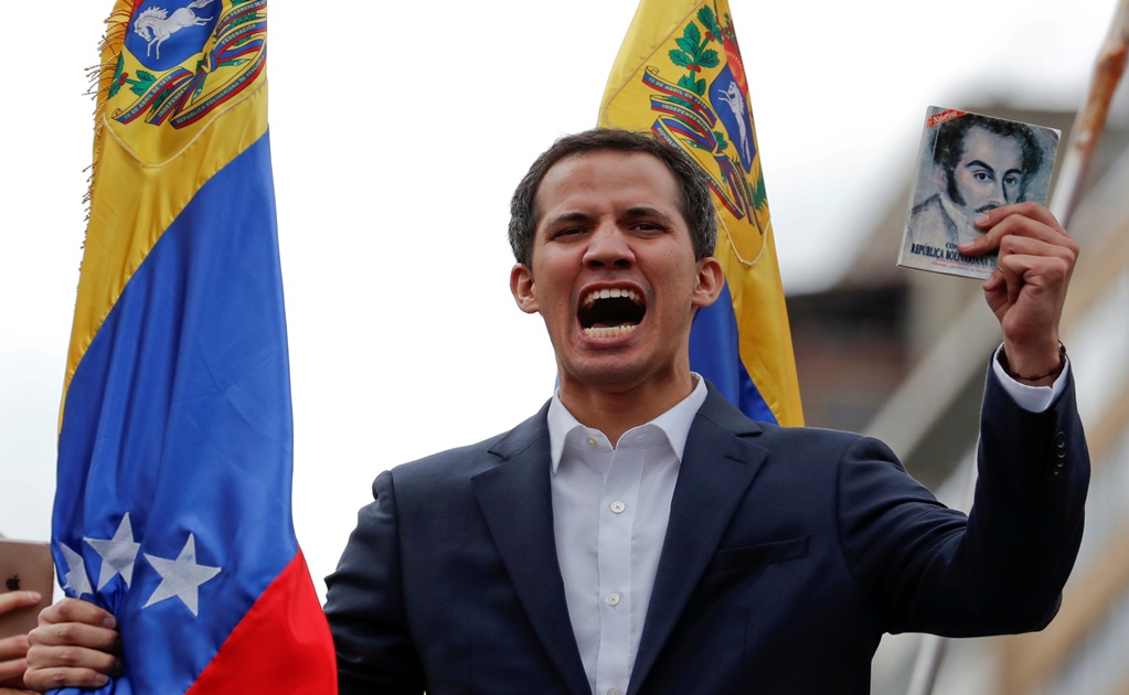 Buoyed by protesters, opposition leader Juan Guaidó claims Venezuela presidency
