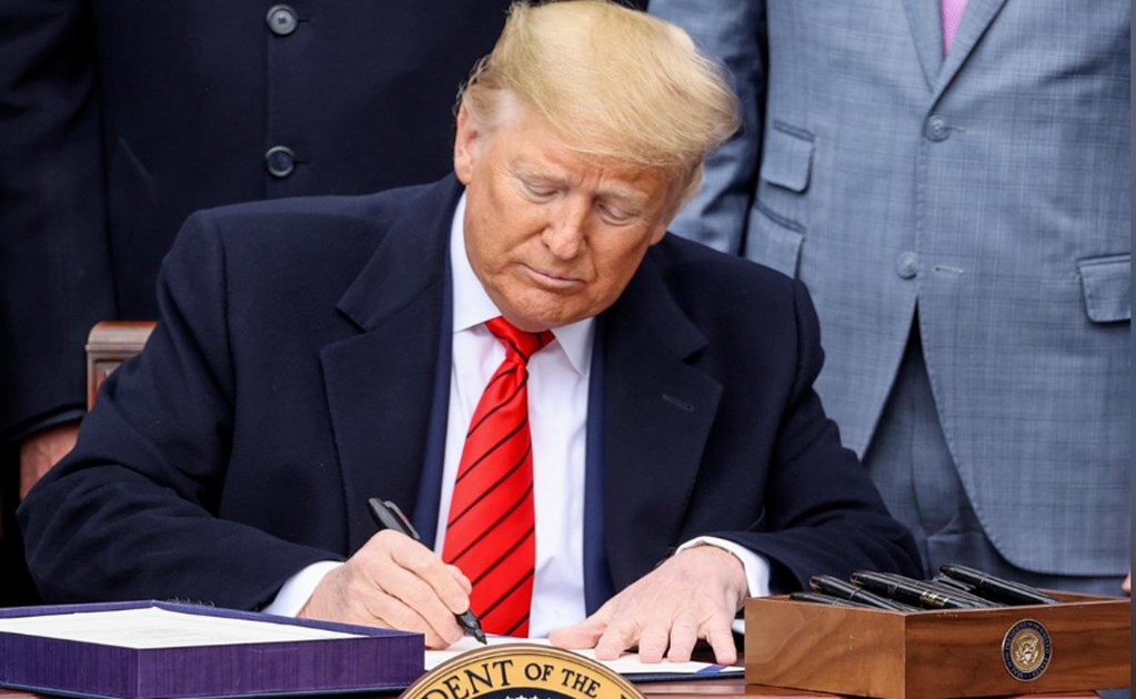 President Donald Trump signs USMCA trade deal