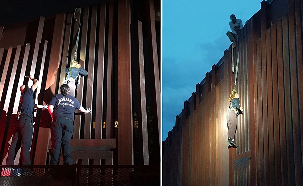 Patrulla fronteriza de EU rescata a mexicana colgada de valla fronteriza