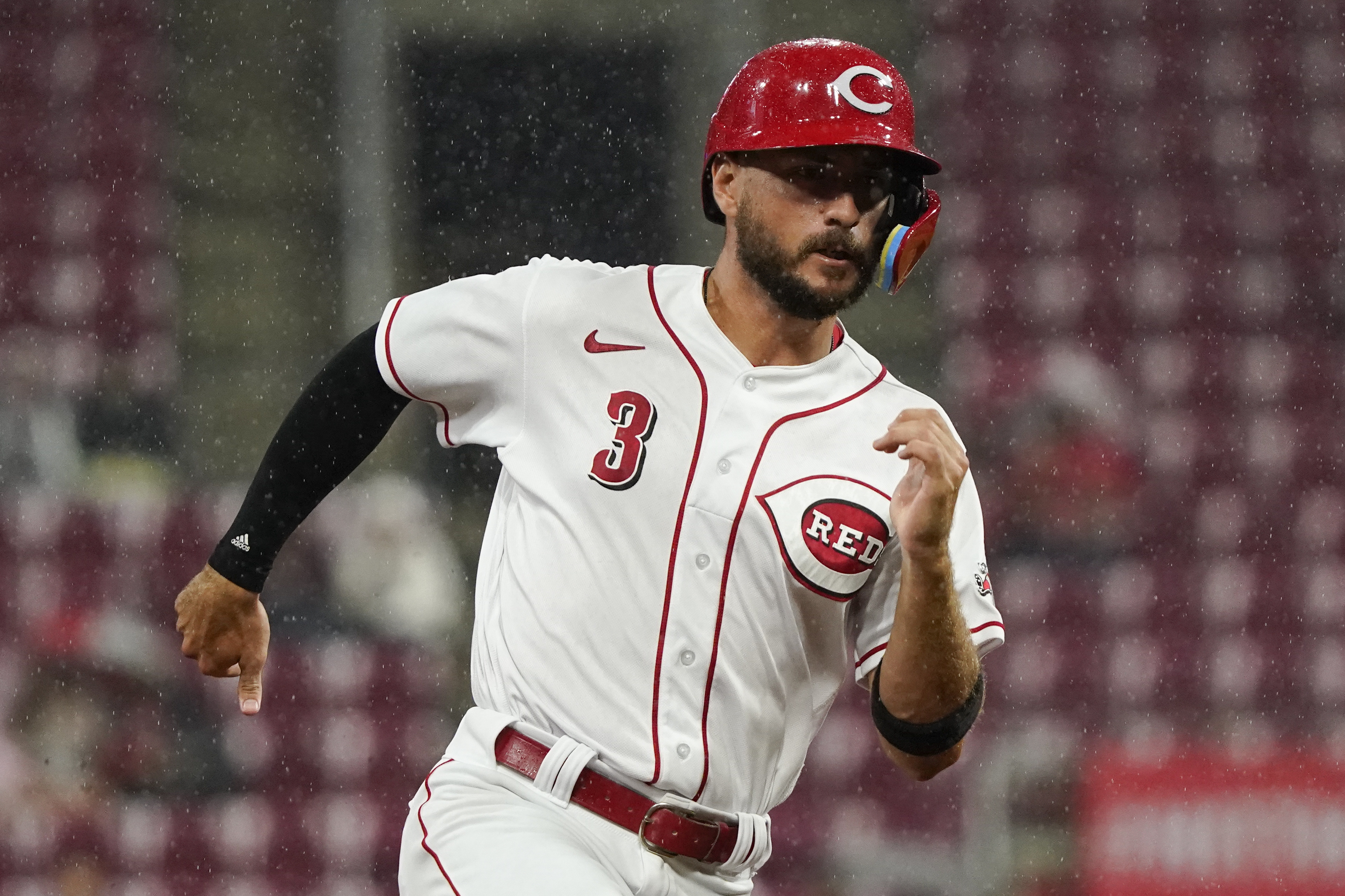 Greene retires 20 straight in rain-shortened win for Reds