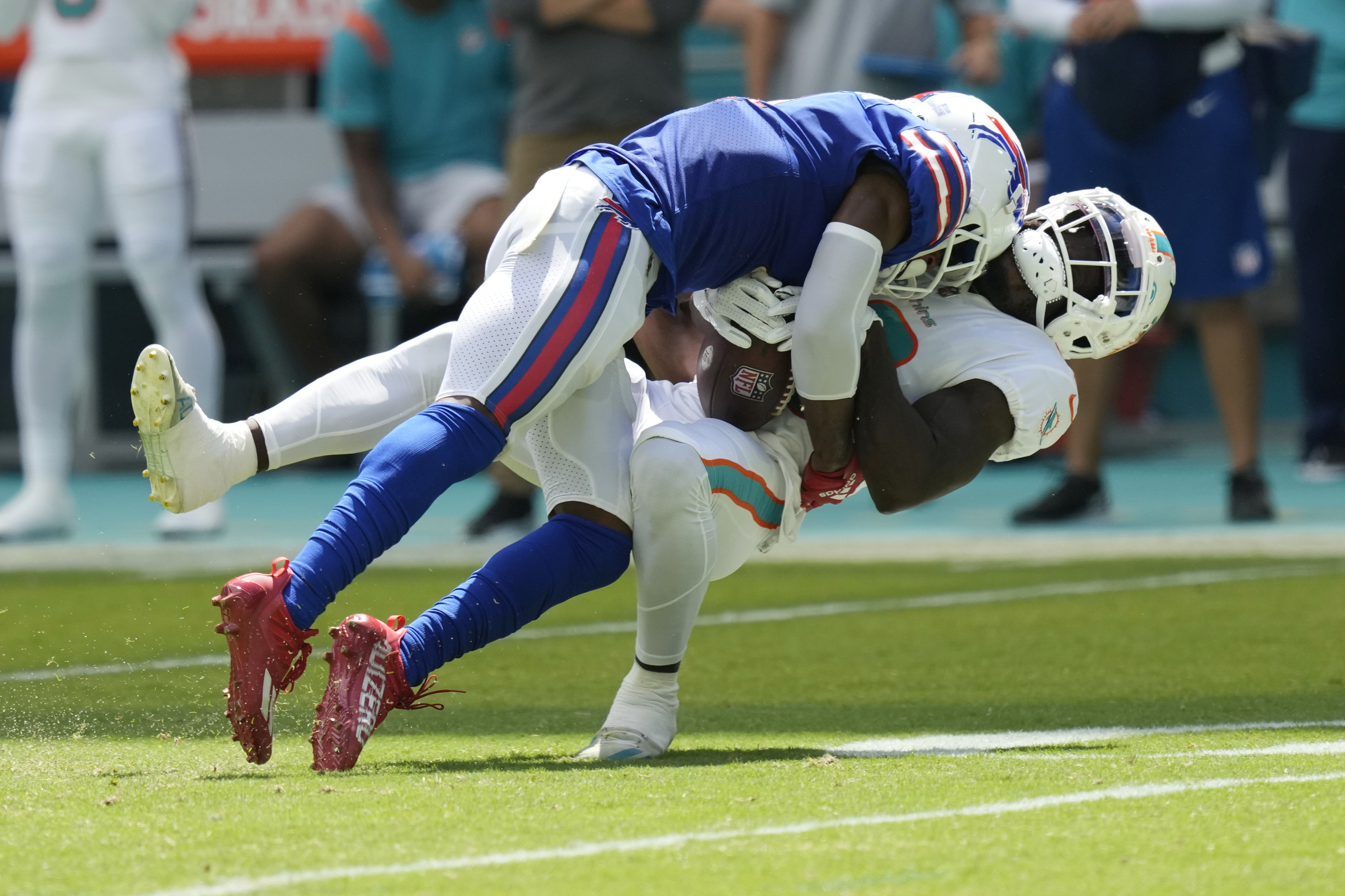 Dolphins halt Allen, survive 'butt punt' to beat Bills