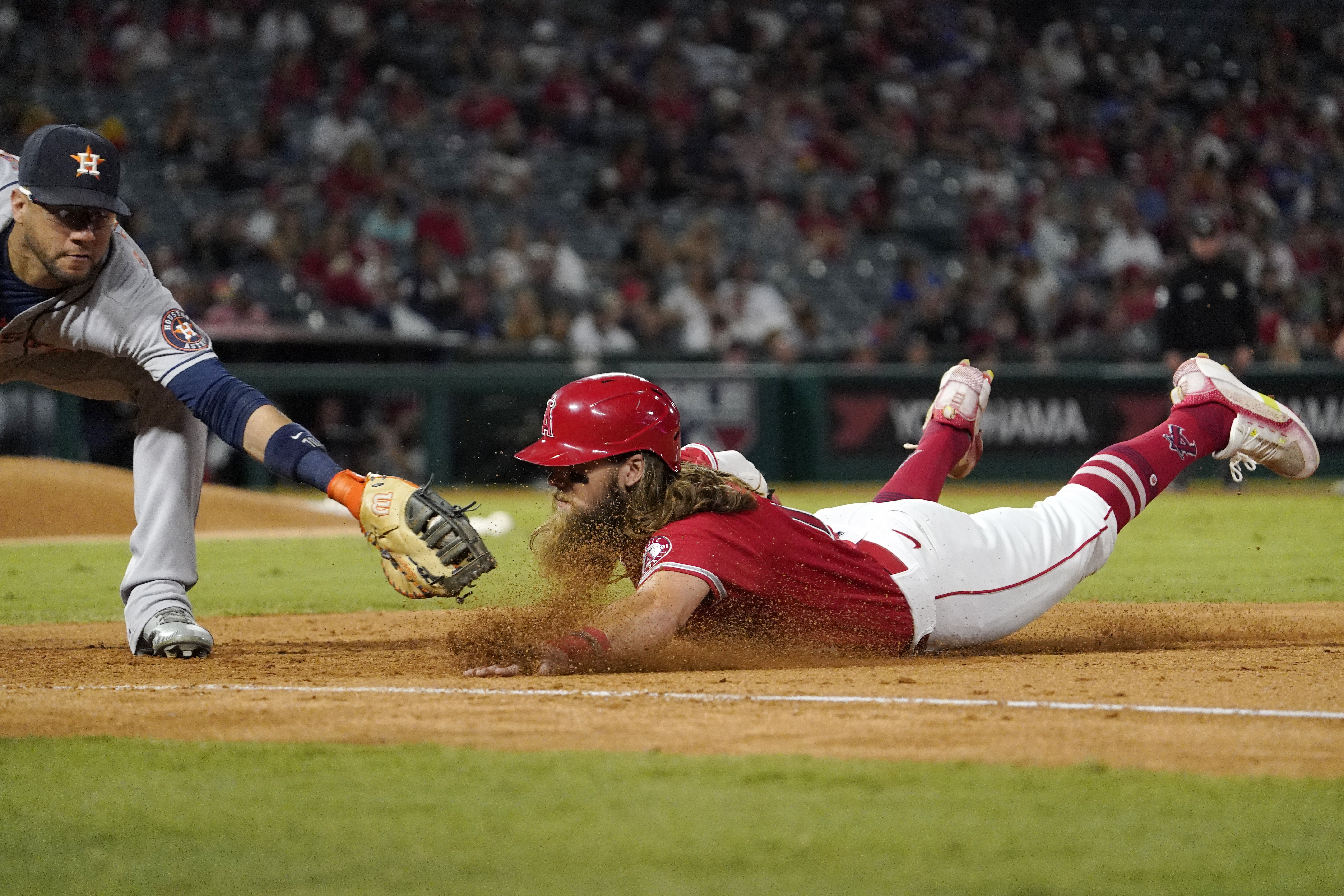 Astros move closer, beat Angels in 12; Ohtani out at plate