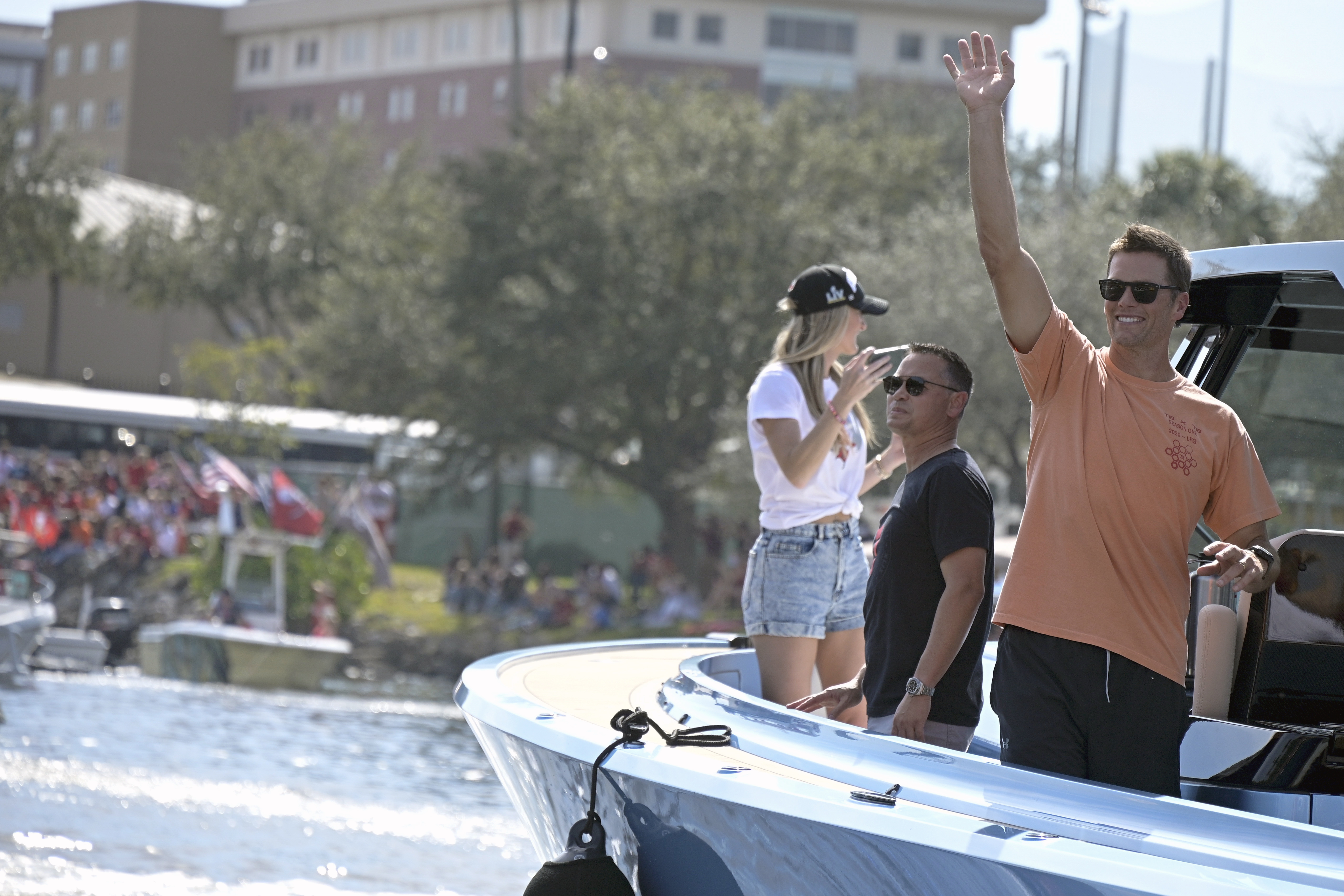 Tom Brady casually throws the Lombardi Trophy as Bucs celebrate